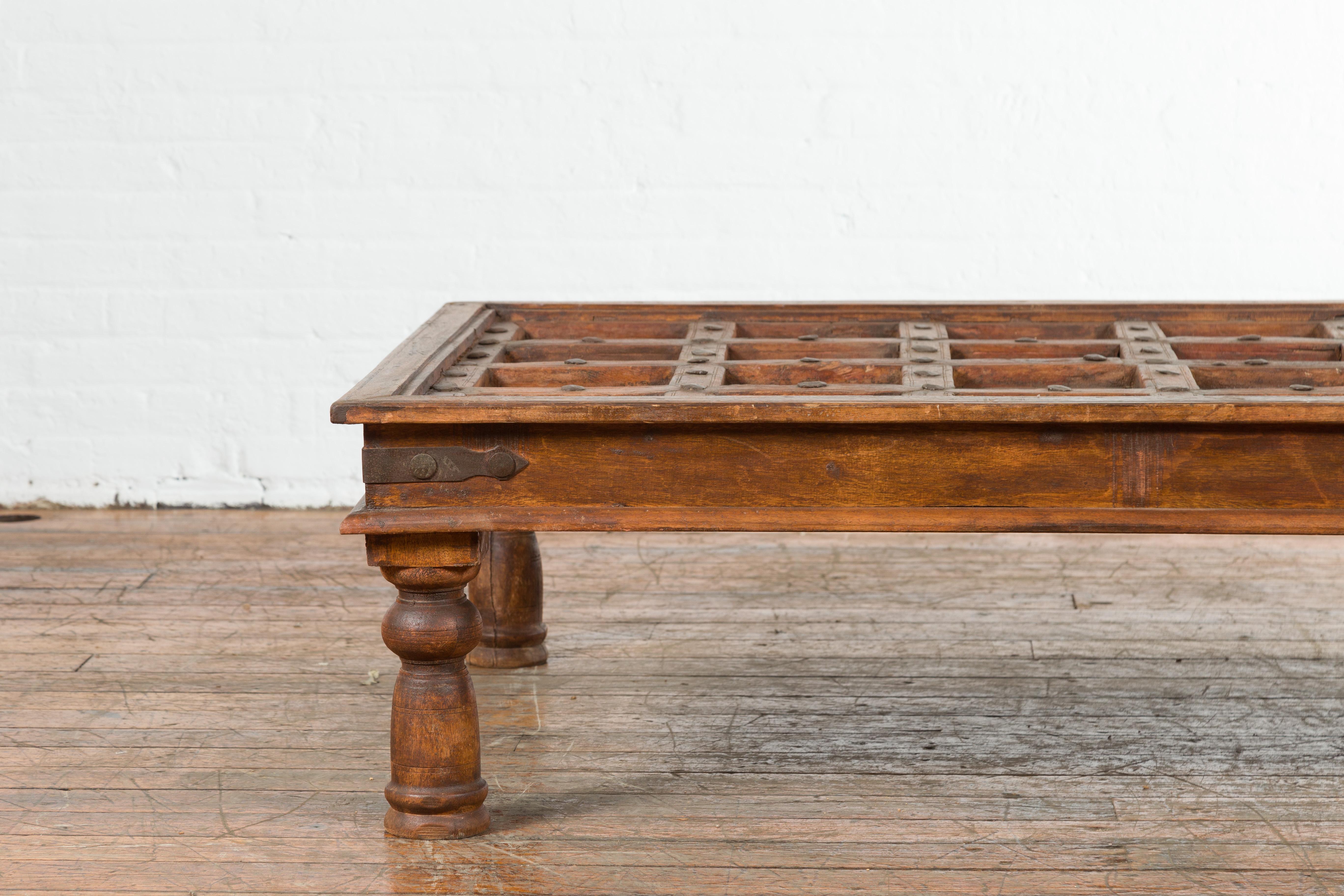 Indian 19th Century Paneled Door with Iron Accents Turned into a Coffee Table 1