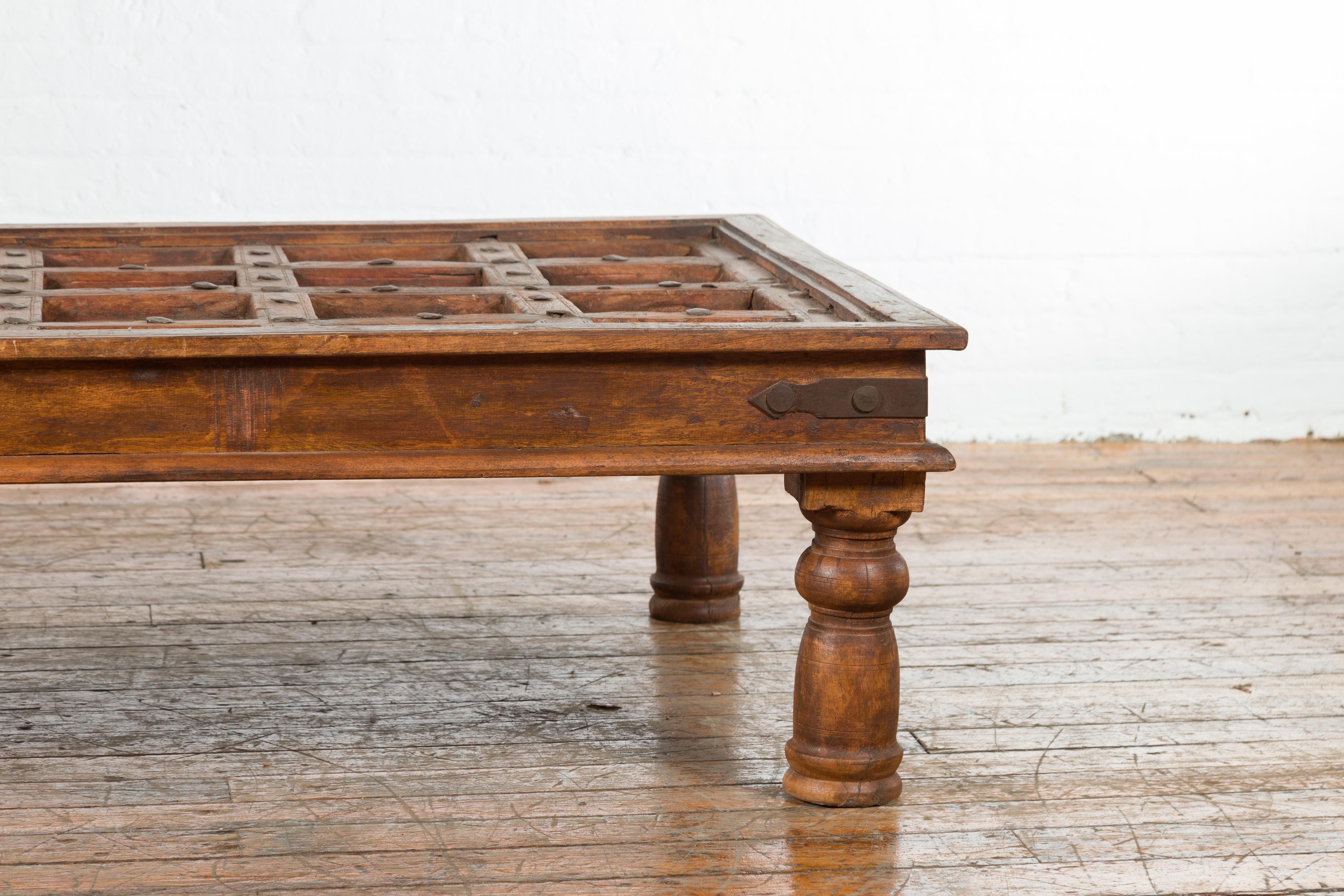 Indian 19th Century Paneled Door with Iron Accents Turned into a Coffee Table 2