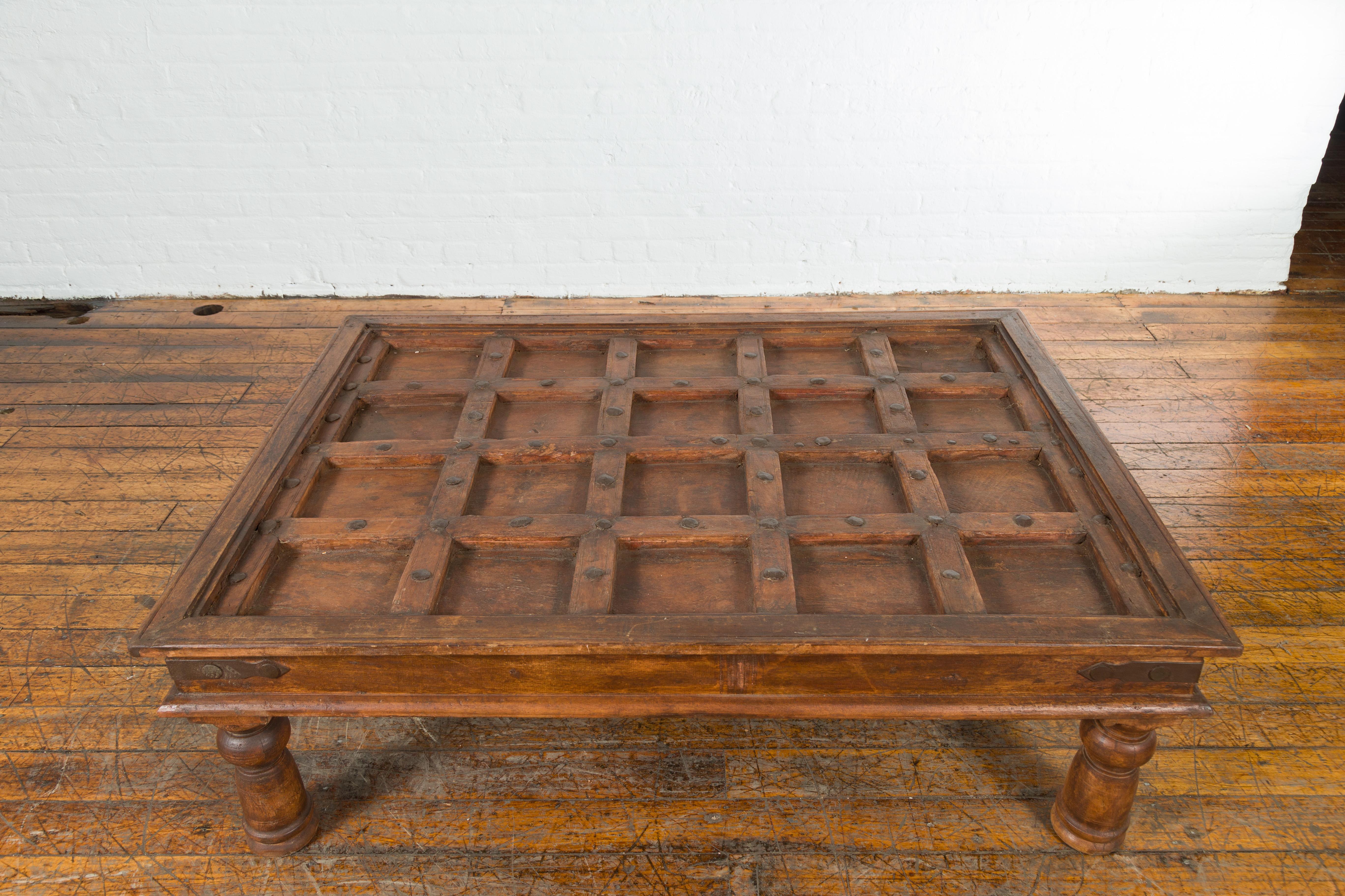 Indian 19th Century Paneled Door with Iron Accents Turned into a Coffee Table 3