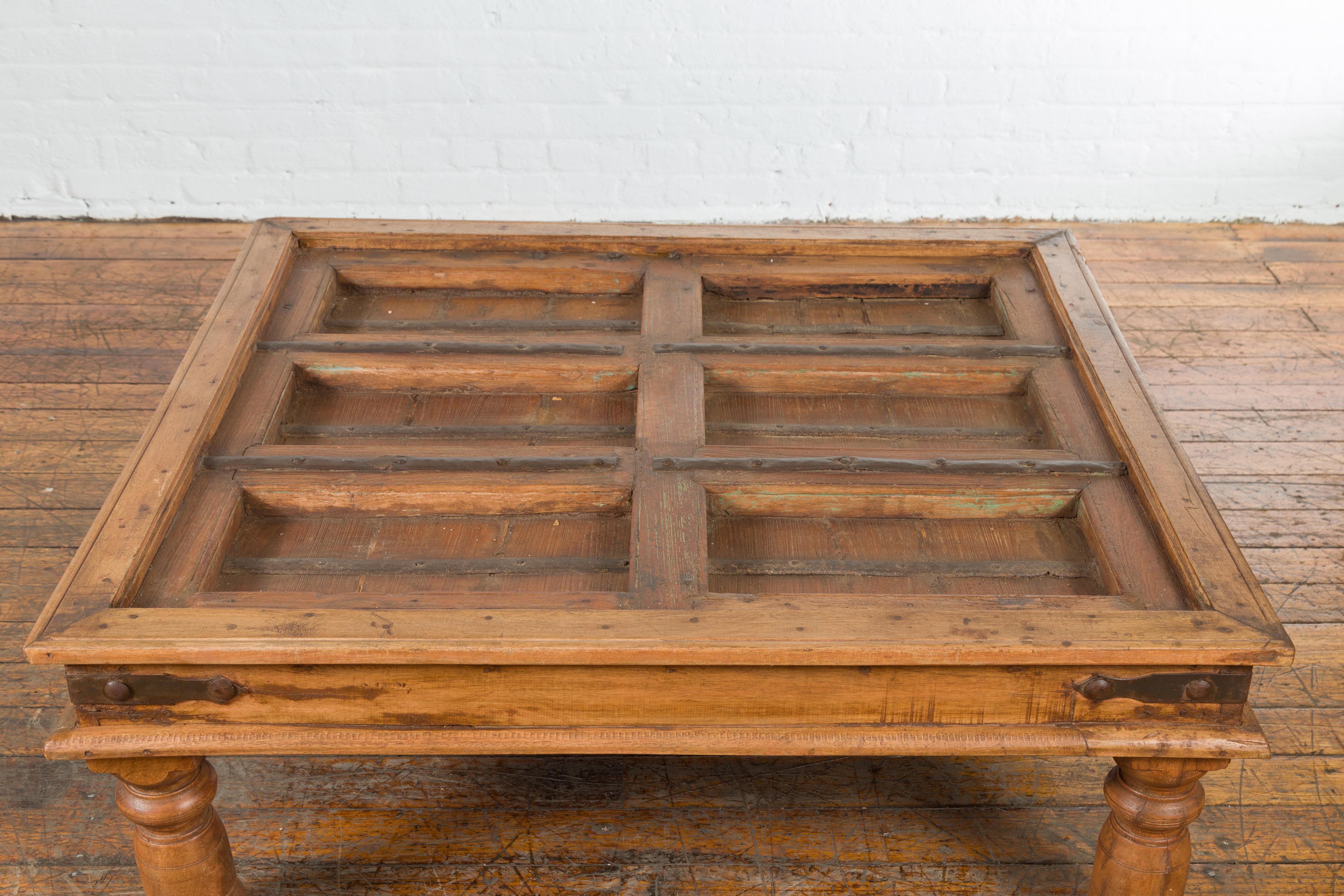 19th Century Indian Paneled Door with Iron Accents Converted into a Coffee Table For Sale 1