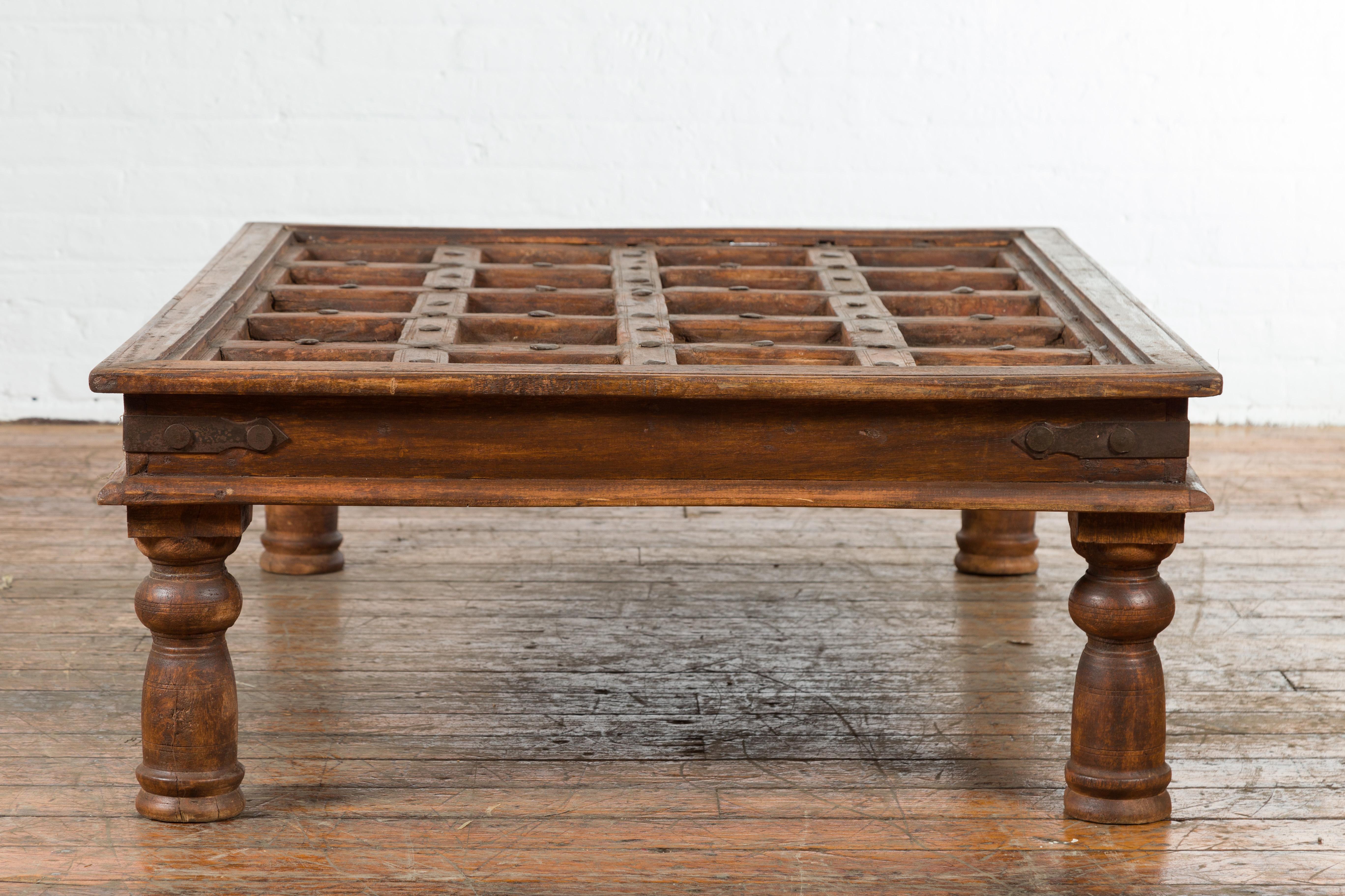 Indian 19th Century Paneled Door with Iron Accents Turned into a Coffee Table 5