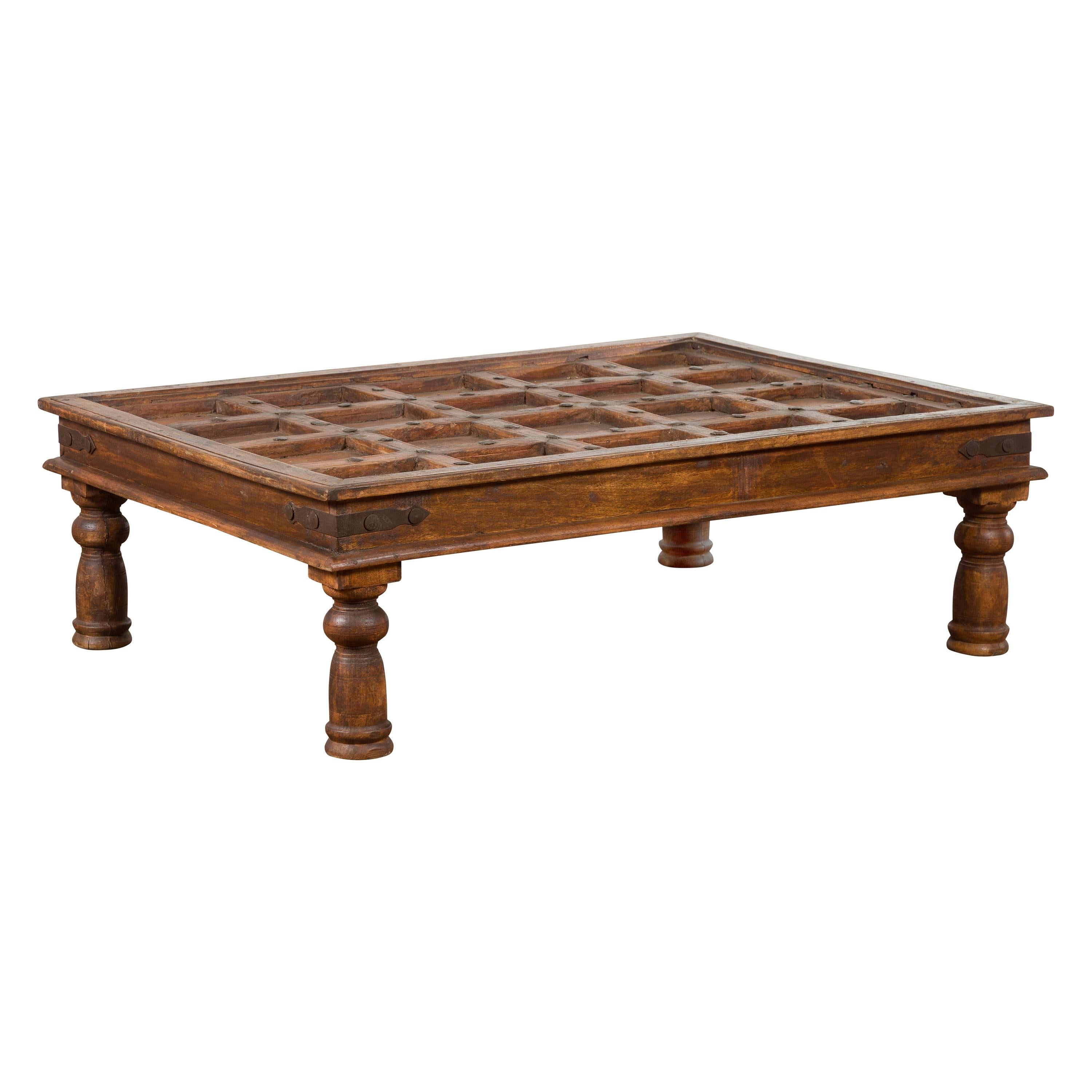 Indian 19th Century Paneled Door with Iron Accents Turned into a Coffee Table