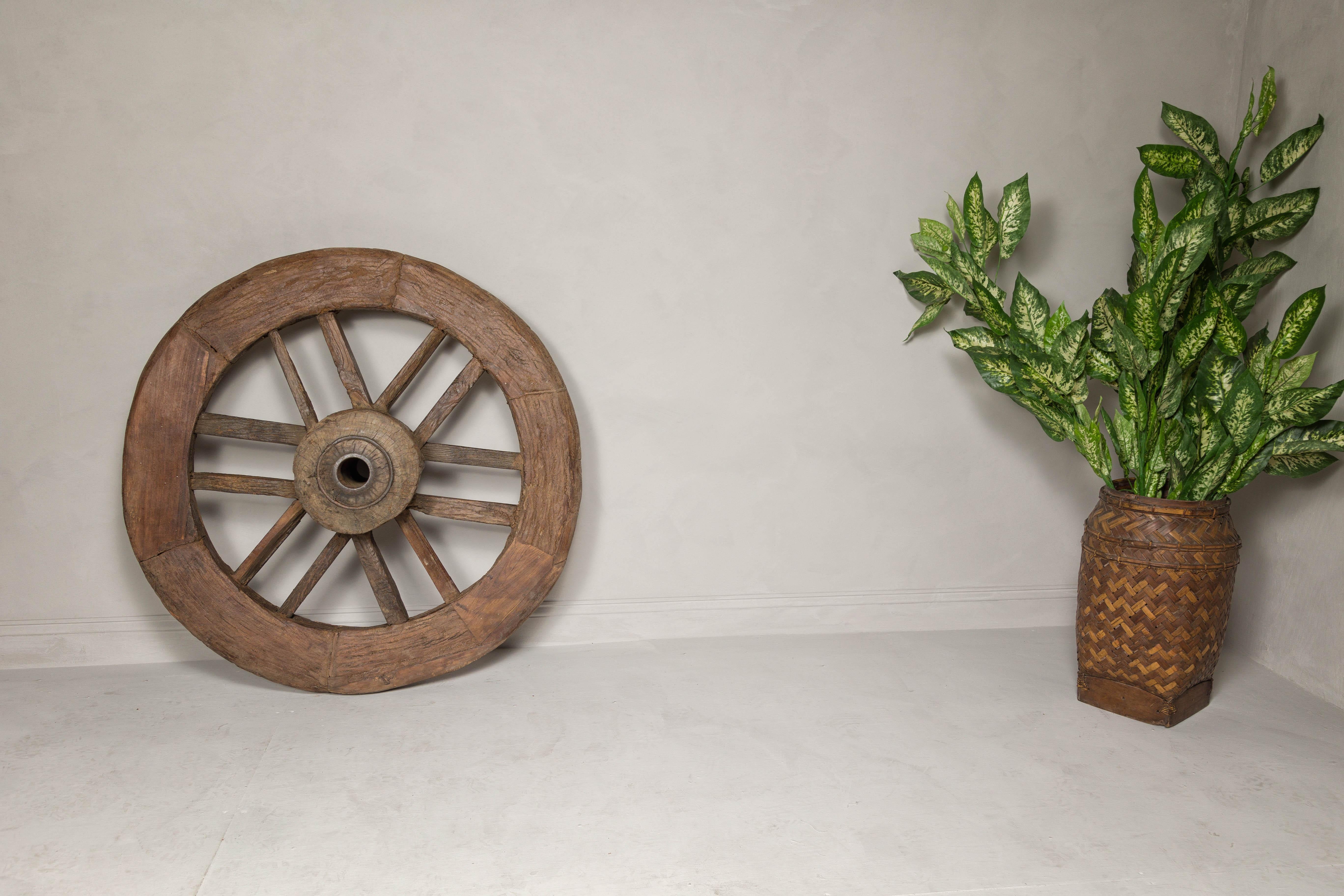 Carved Indian 19th Century Wood and Metal Cart Wheel with Rustic Character For Sale