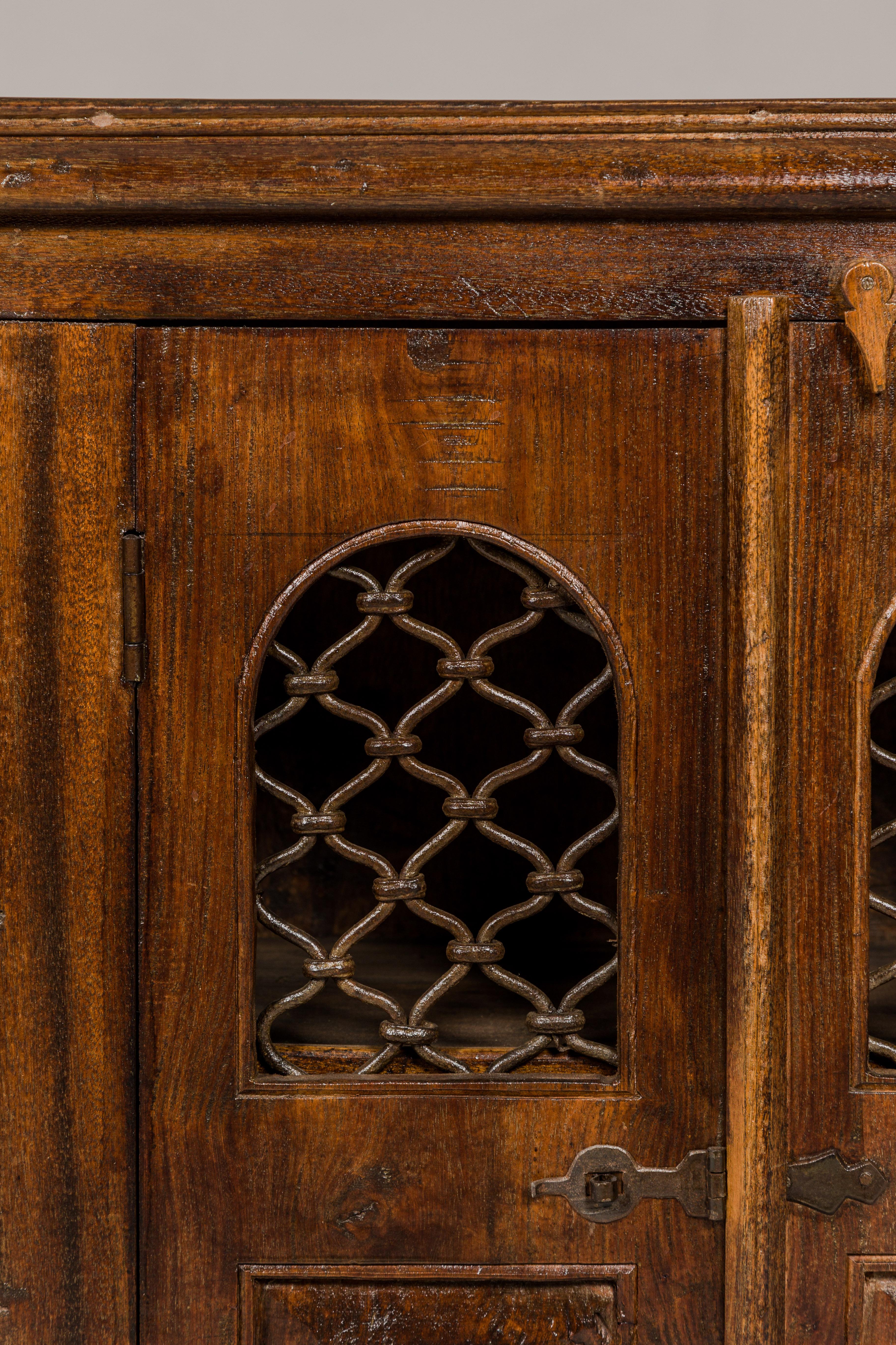 Indian 19th Century Wooden Side Cabinet with Arched Metal Grate Window Door For Sale 3
