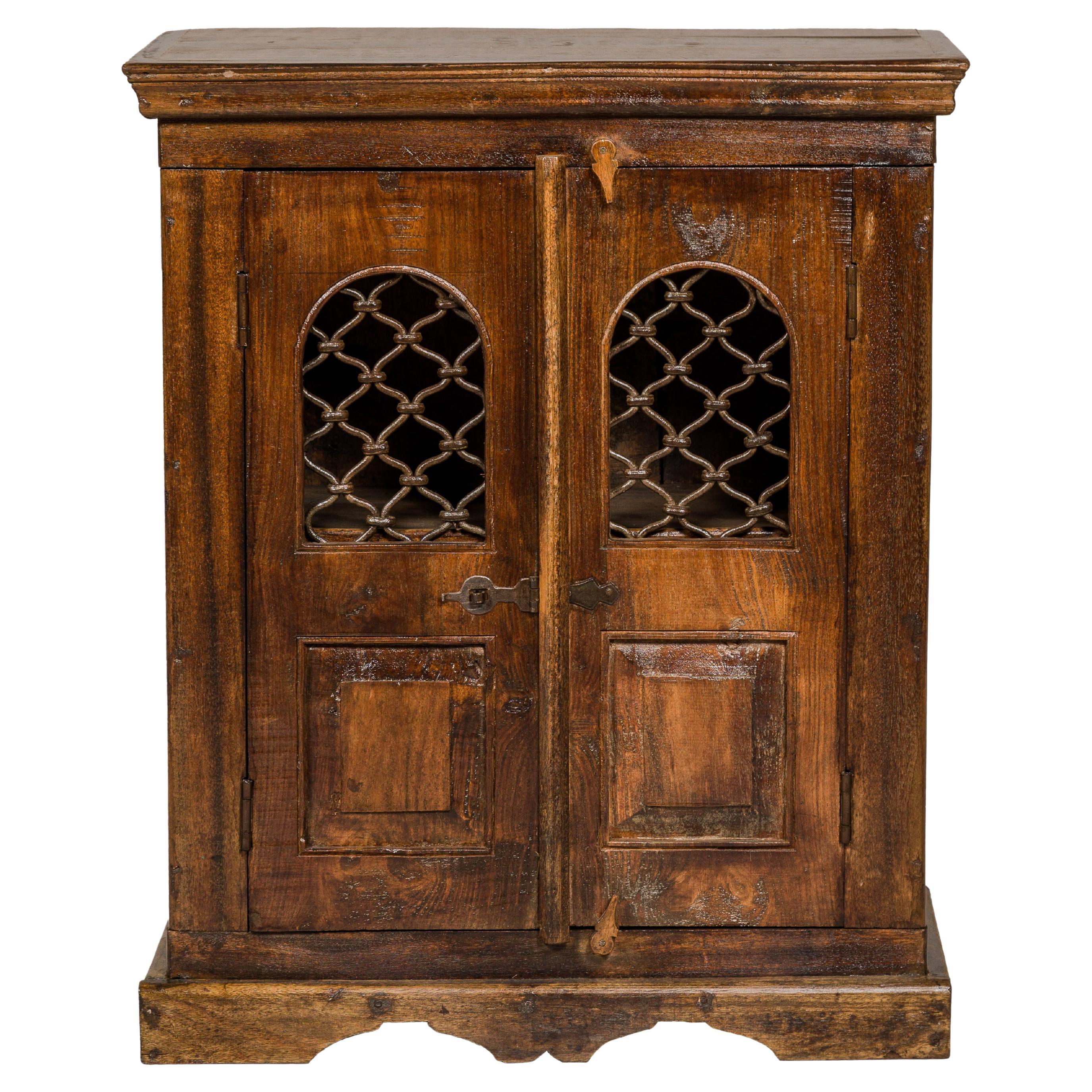 Indian 19th Century Wooden Side Cabinet with Arched Metal Grate Window Door For Sale