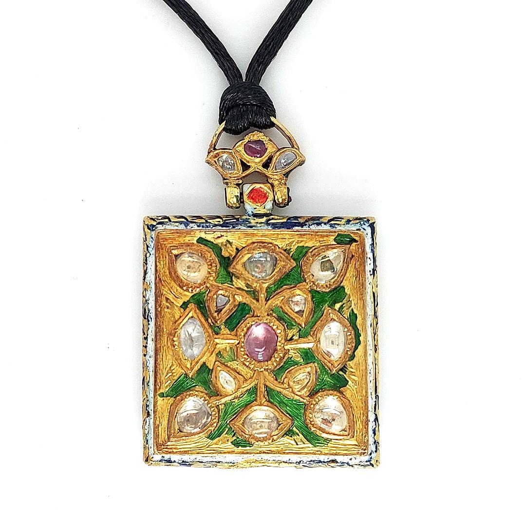 Indian 2 Sided Pendant/Amulet With Diamonds & Ruby / Enamel against bad spirits

Double sided pendant with Diamonds& Ruby on one side And Floral Enamel on the other side.

Amulets are ornamental accessories, and were worn to fend off the evil