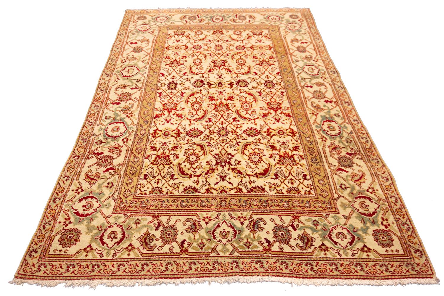 This Indian Agra Antique rug Beige Field Floral All-over is a beautiful and detailed piece that would be perfect for any home. The all over field with stylized motif design is extremely detailed, and the wool pile with cotton warp and weft makes it