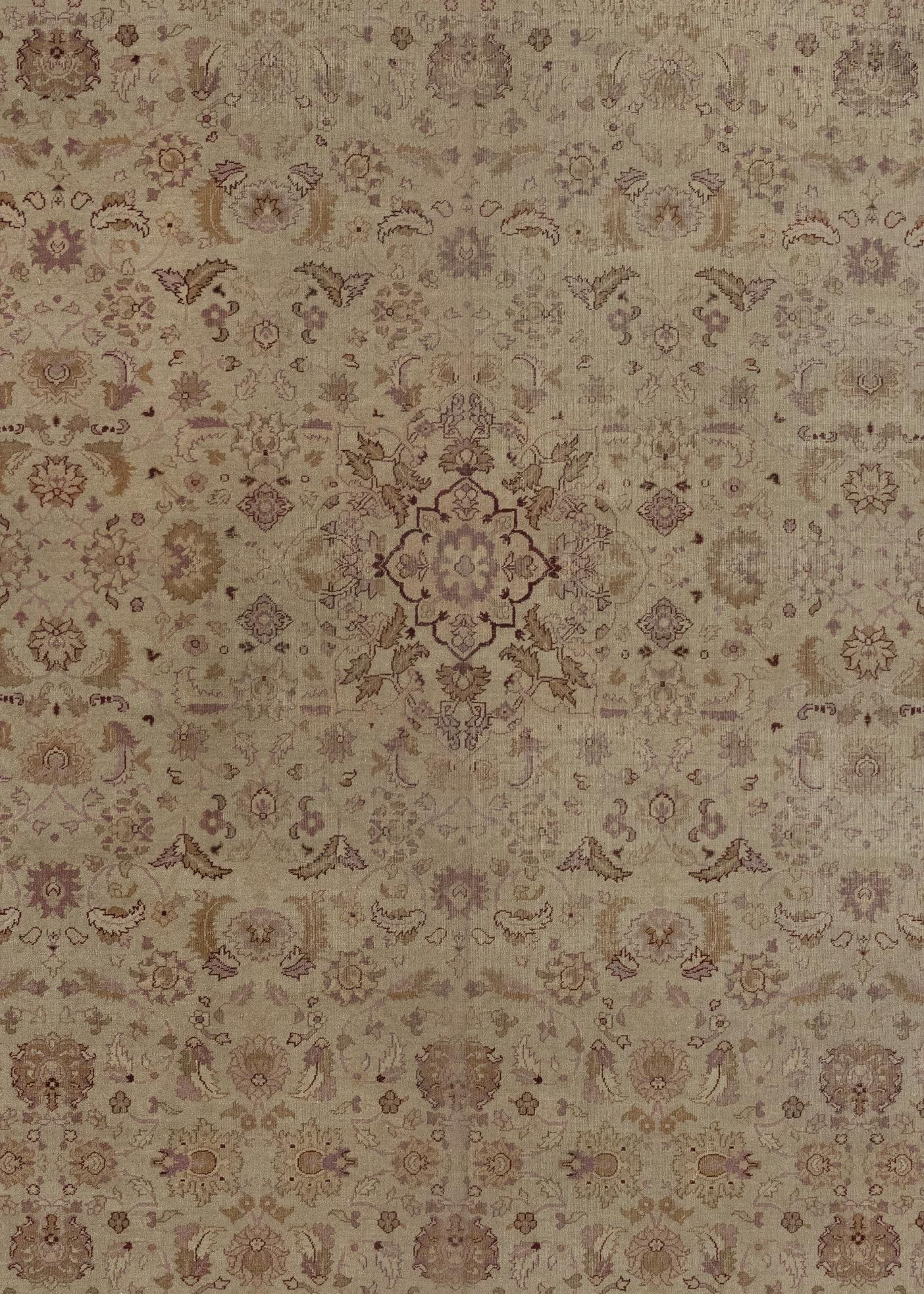 This is a beautiful rug featuring delicate floral patterns and a soft color palette of beige, brown, pinks, and crimson.