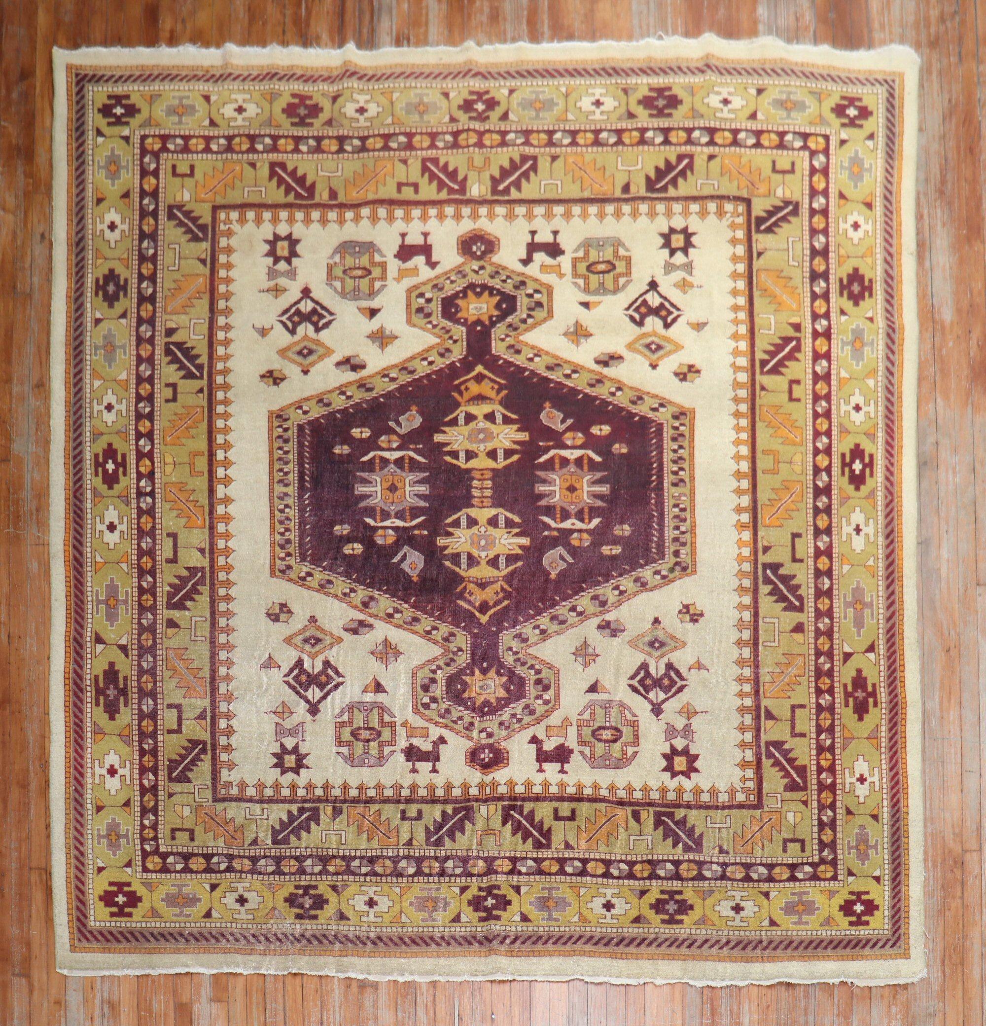High decorative room square size early 20th century antique Indian Amritsar rug from the early 20th century. Pea Green, burgundy, bronze accents on a beige field

circa 1900-1910. Measures: 8'10'' x9'6