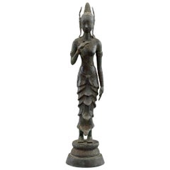Indonesian Antique Bronze Figure of a Slender Goddess with Lotus Flower