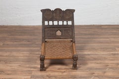 Indian Antique Rustic Low Seat Wooden Chair with Carved Rosettes and Rope Seat