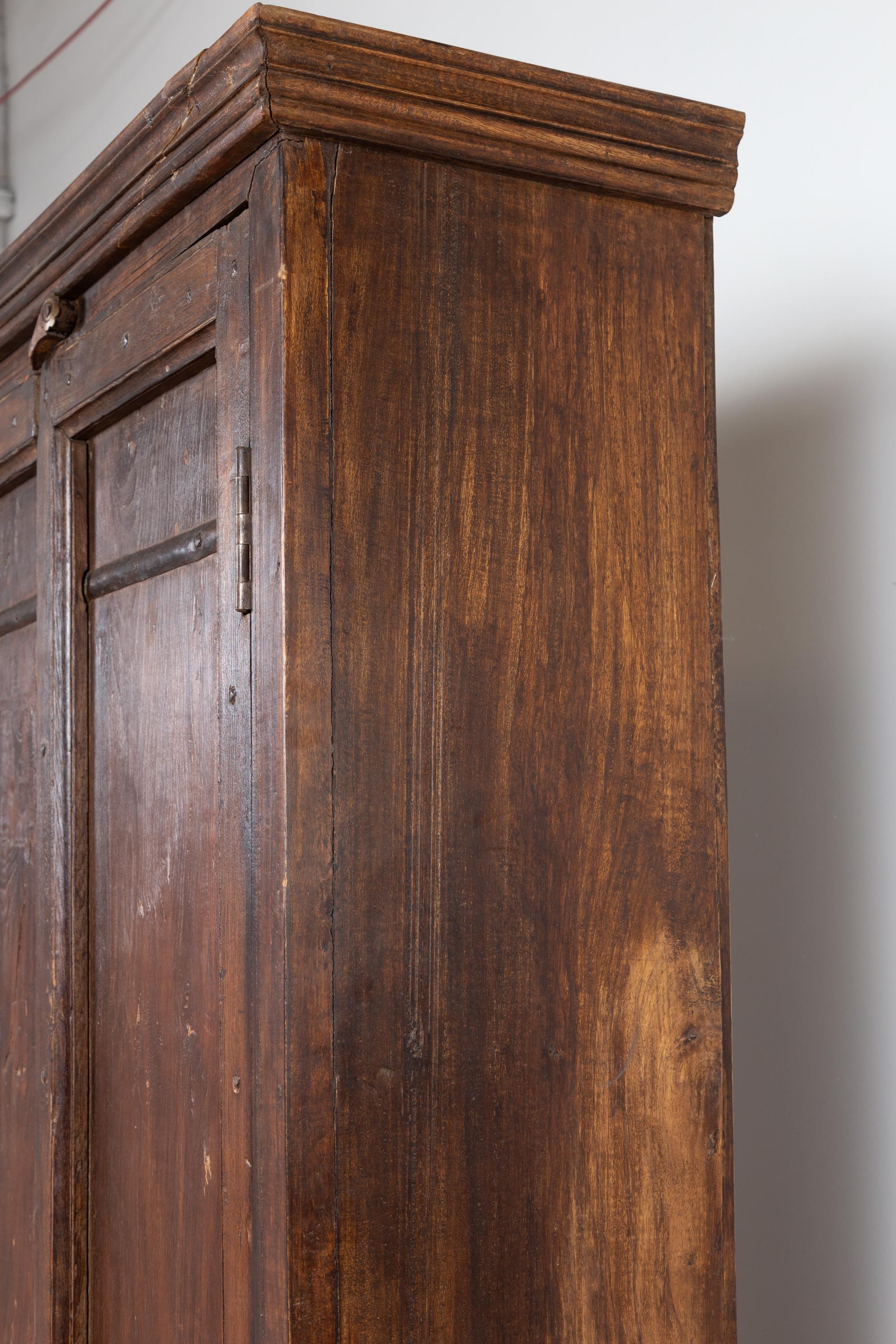 Indian Antique Wooden Armoire with Paneled Doors, Metal Braces and Aged Patina 6