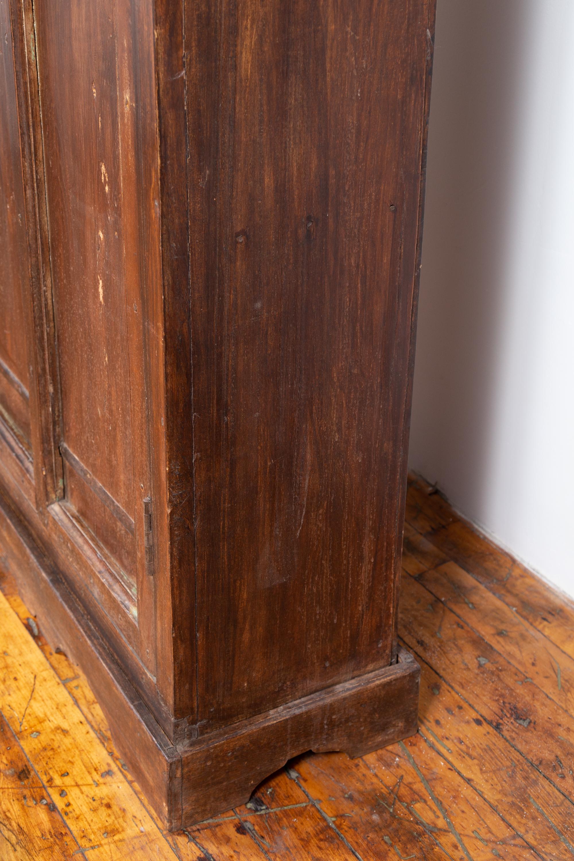 Indian Antique Wooden Armoire with Paneled Doors, Metal Braces and Aged Patina 9