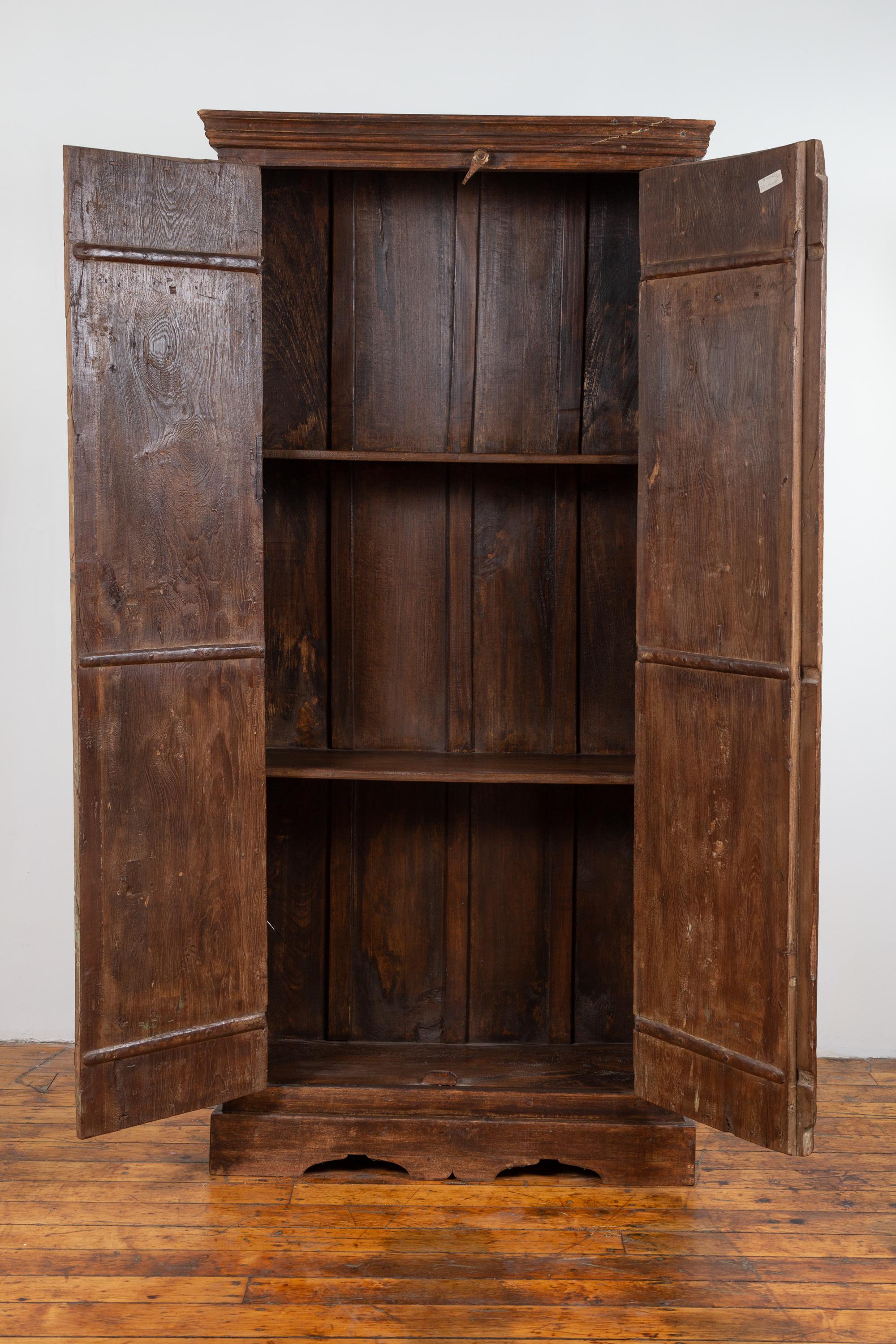 Indian Antique Wooden Armoire with Paneled Doors, Metal Braces and Aged Patina 10