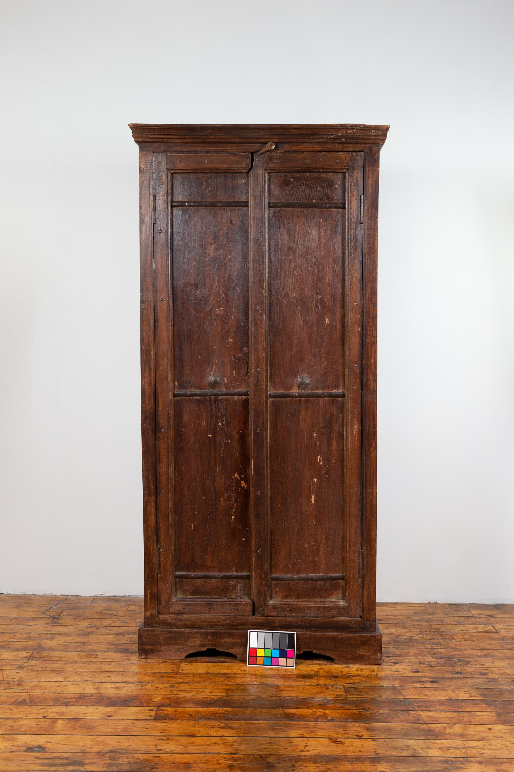 Indian Antique Wooden Armoire with Paneled Doors, Metal Braces and Aged Patina 12