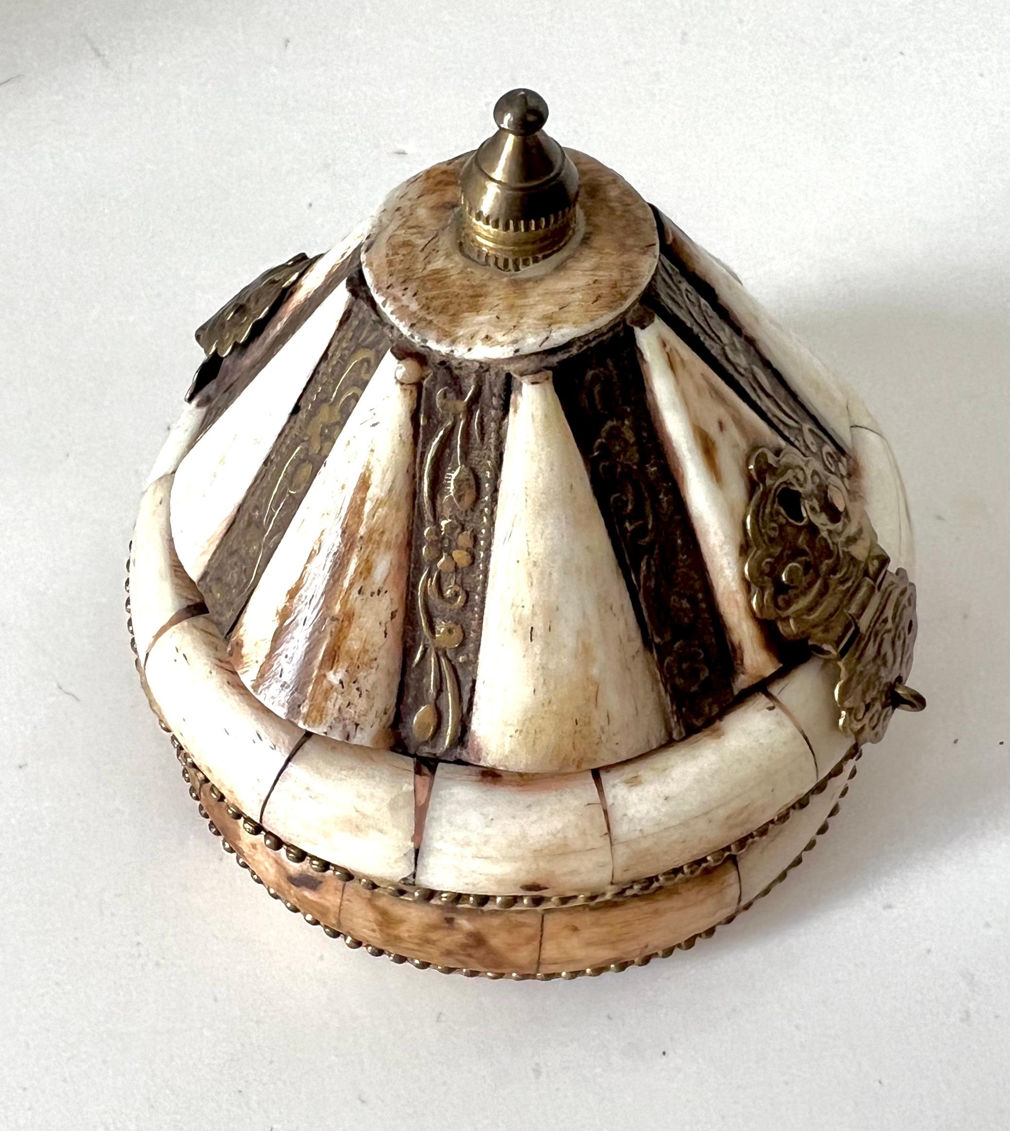 A lovely dome shaped bone box from India.  The box can be decorative or hold anything from rubber bands to 420.  A compliment to cocktail tables, shelves, bedside or on an end table - 

Hand-crafted and beautifully made.