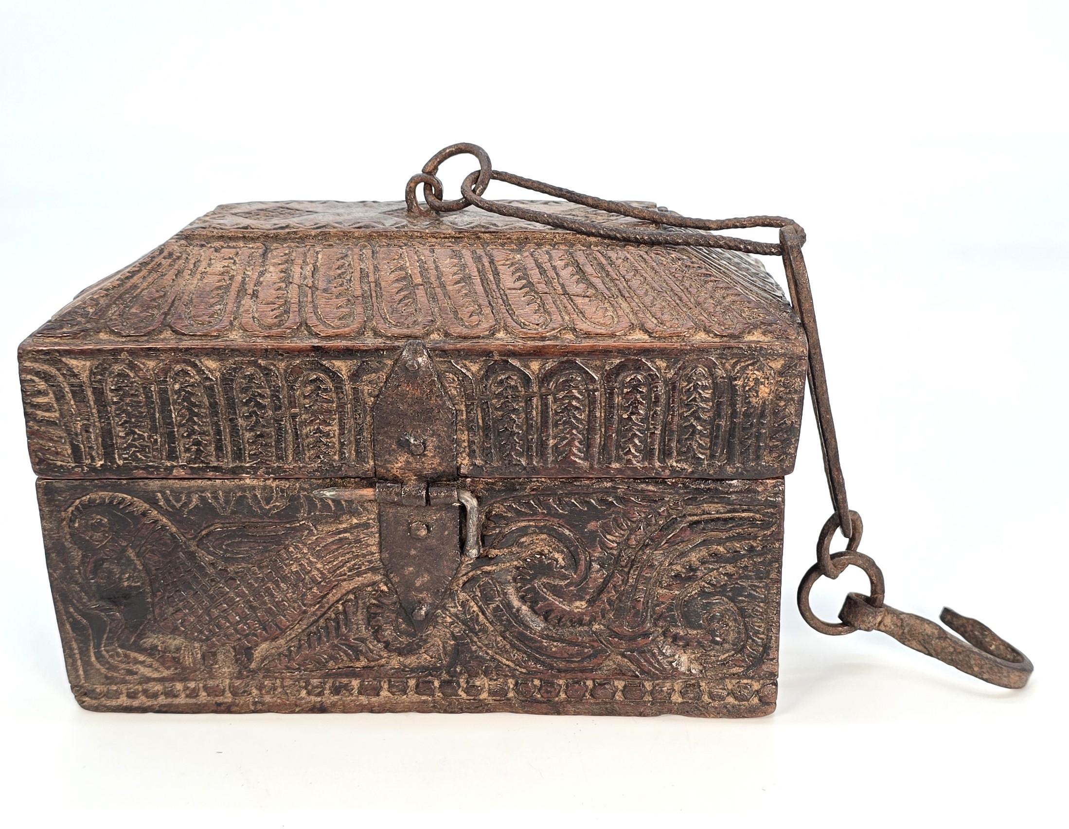 This superb Indian spice box is of a larger scale than normally seen. It is highly decorative and original. It is made from a solid block of dense wood with a well-hollowed, chiselled-out interior.

All the fittings are original and are hand-made in