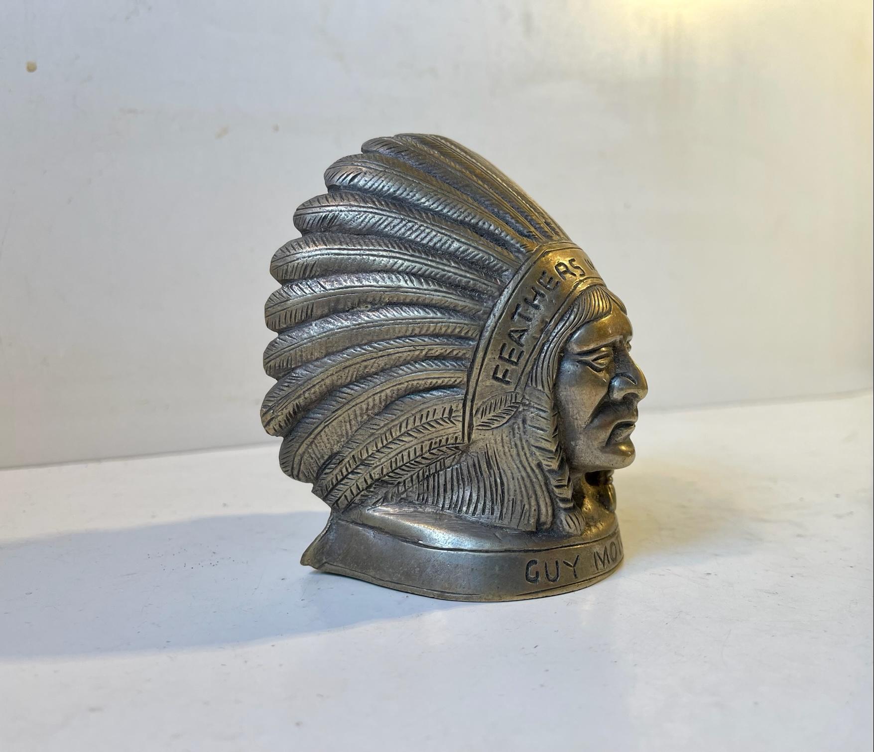 Original hood ornament / mascot depicting an Indian Chief in full head dress, entitled and inscribed 