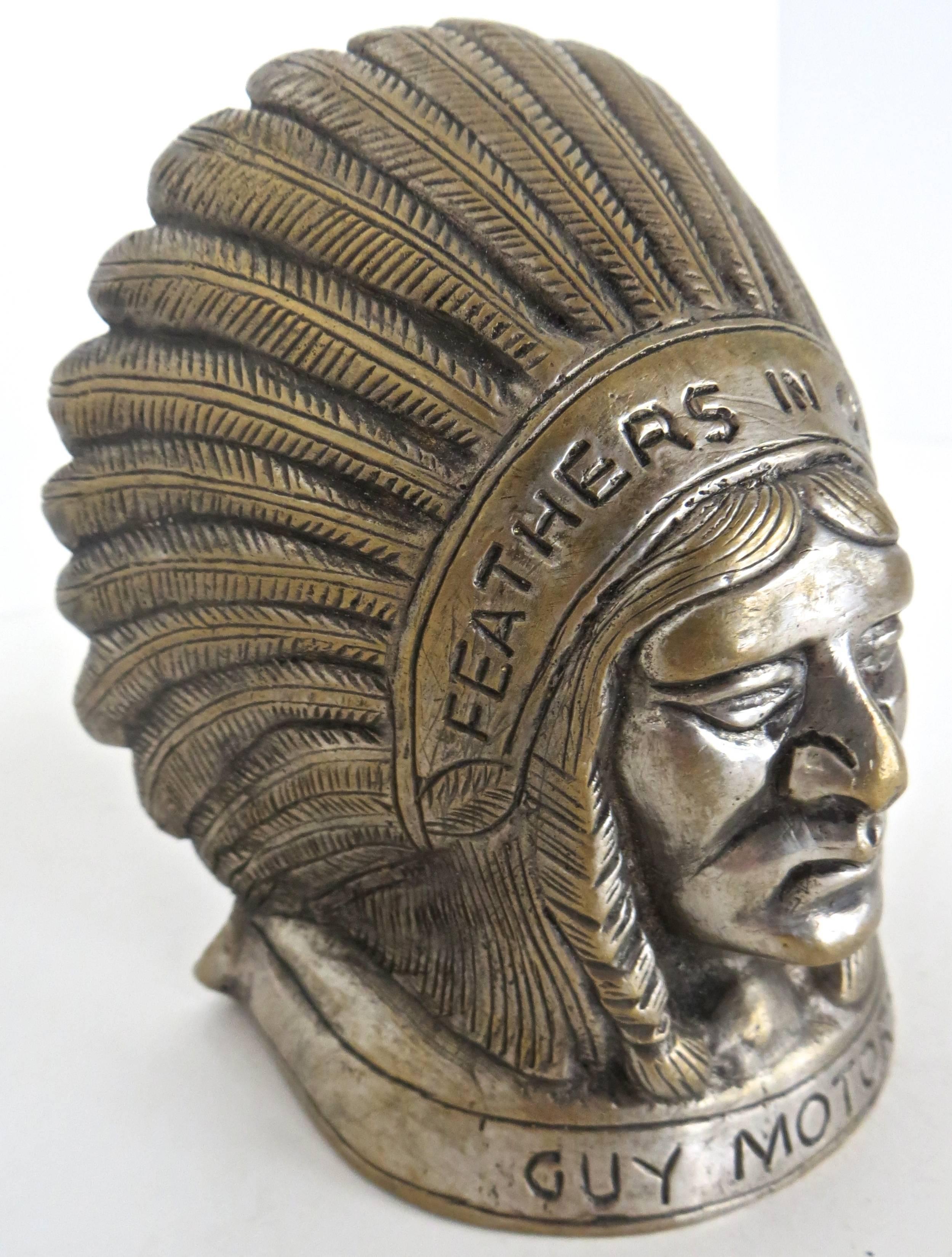 Actual original hood ornament of an Indian in full head dress, entitled and embossed 