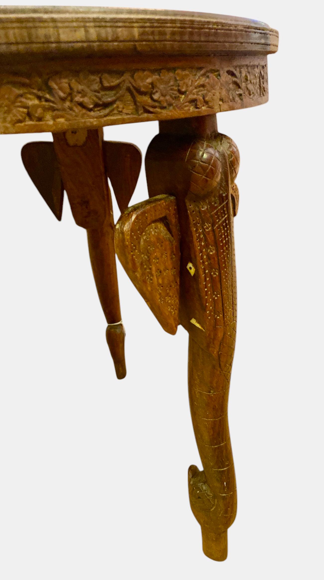 Hand-Carved Indian coffee table with elephant-heads legs shaped like elephant heads