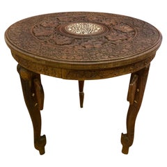 Indian coffee table with elephant-heads legs shaped like elephant heads