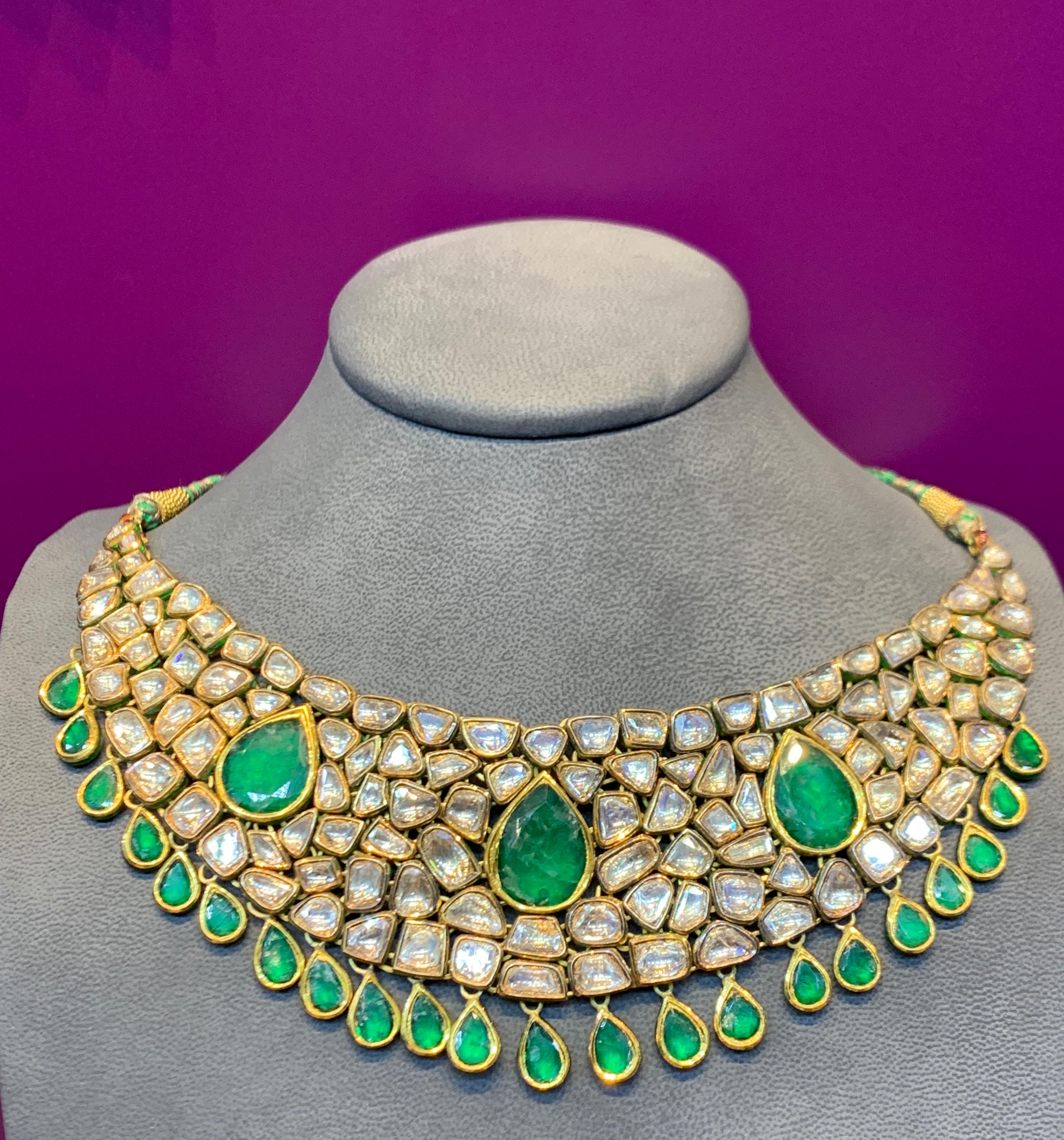 Indian Diamond & Emerald Necklace with multi color enamel on reverse
Rose cut diamonds & pear shape emeralds
Adjustable length
231.4 Grams
