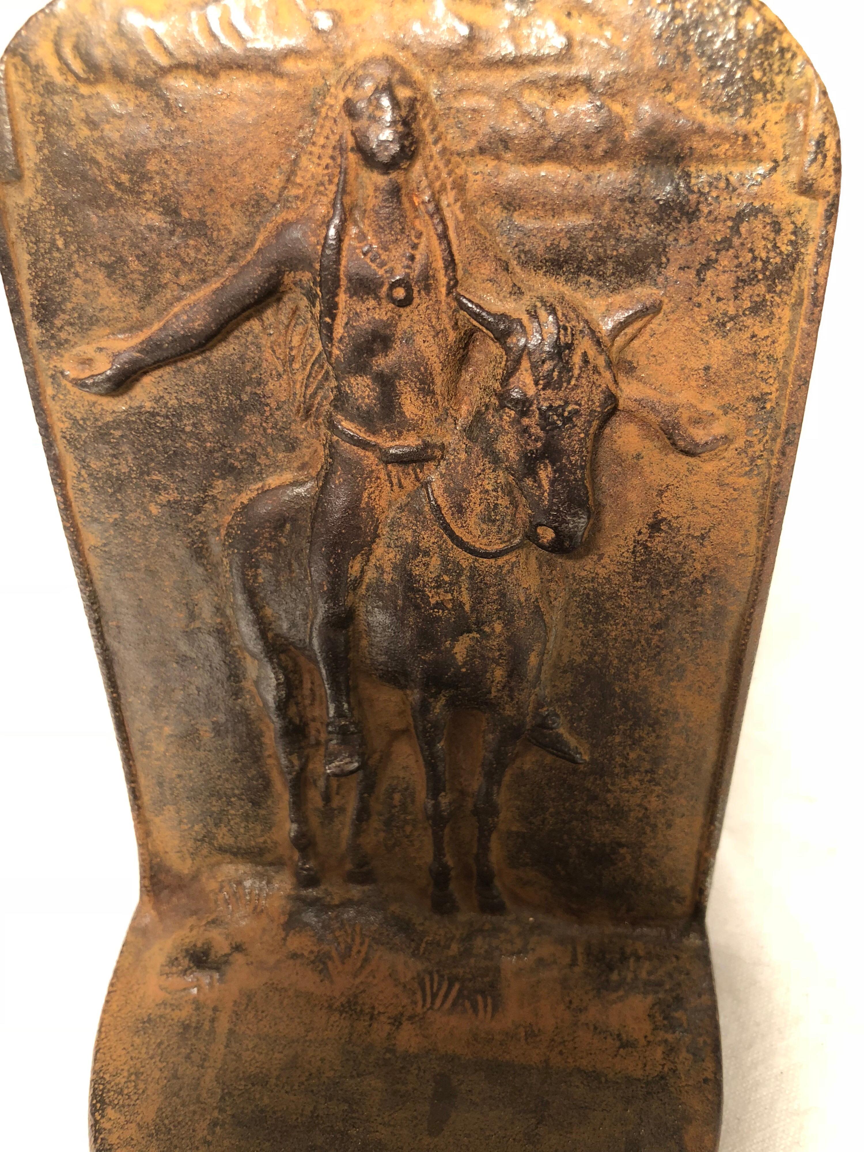 Indian doorstop or bookend. Nice patinated iron of an American Indian on a horse. Signed Bronze net, circa 1925.
This is based on the 