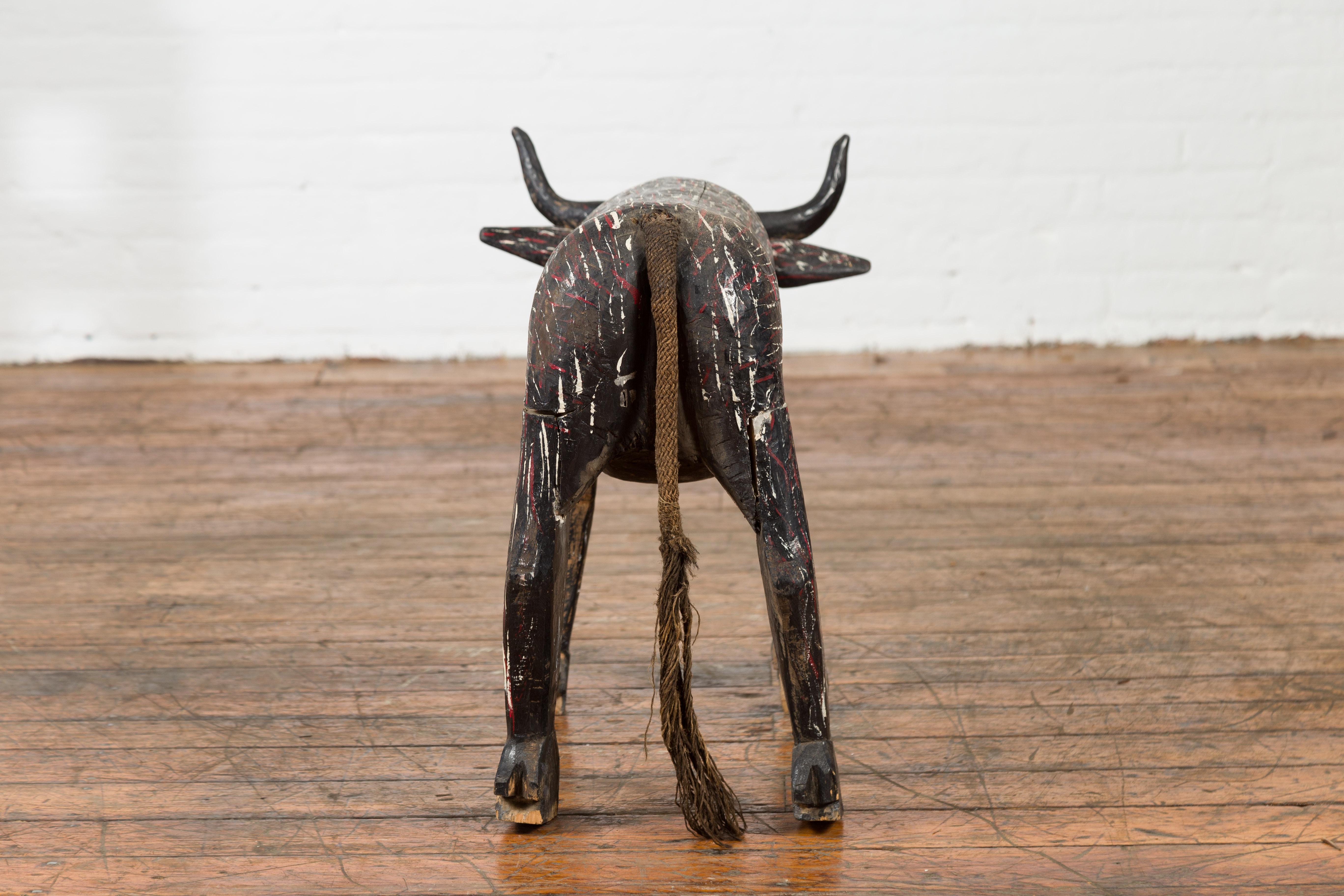 Indian Early 20th Century Hand Painted Wooden Cow with Distressed Patina For Sale 2