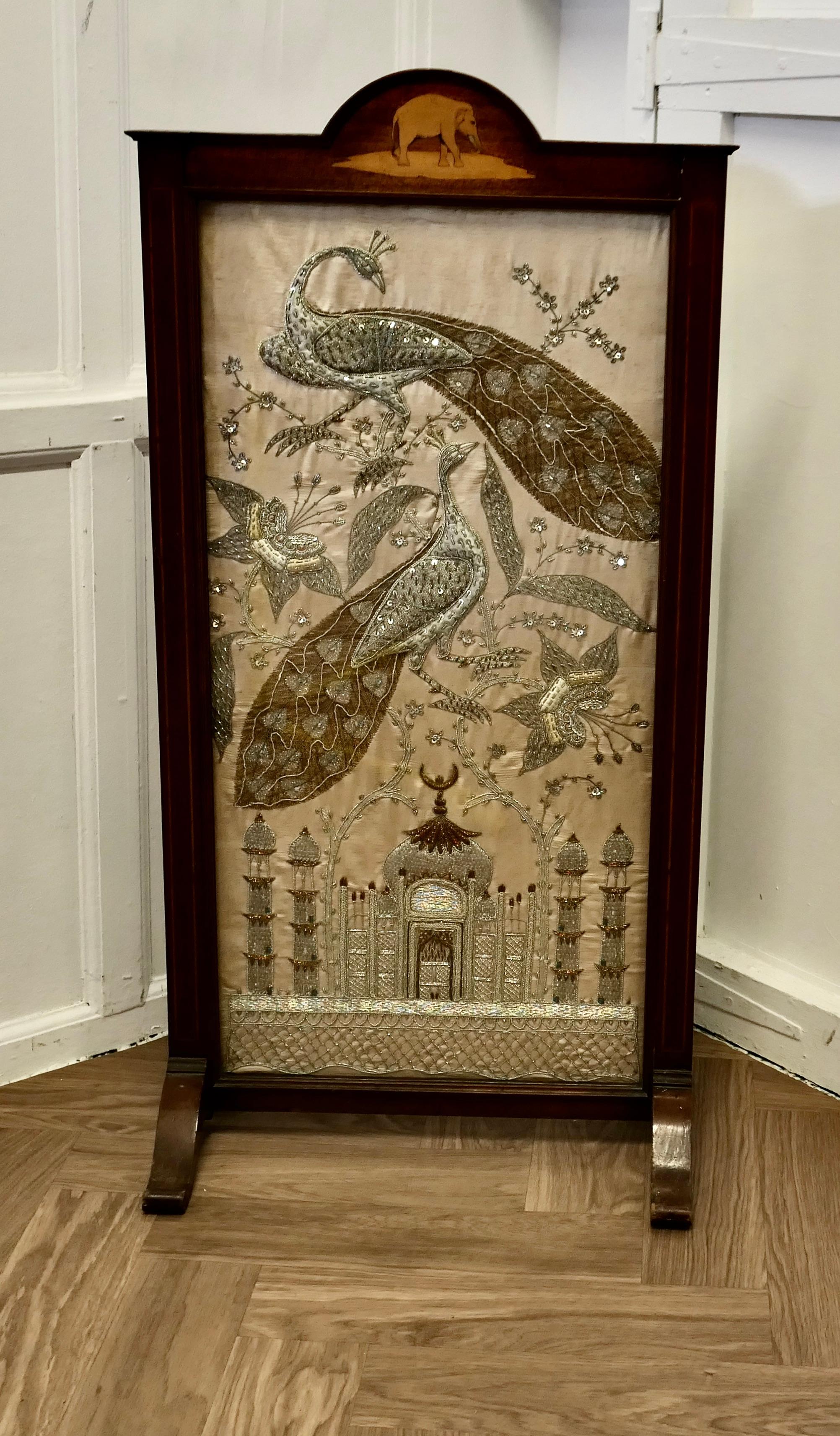 Indian Embroidered Silver and Gold Taj Mahal Screen

This is a fine-looking piece, it is a large screen hand Embroidered on Silk with Silver and Gold Quilting and Threads and a beautiful representation of The Taj Mahal with Giant Peacocks flying