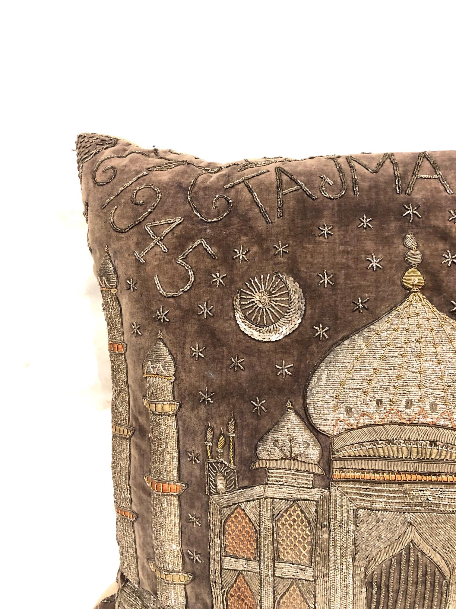 Beautifully embroidered pillow with silver and gold threads, sequins make this pillow sparkle with its Taj Mahal 1945 Agra writing on a silk velvet ground. Burlap backing. Zipper.
