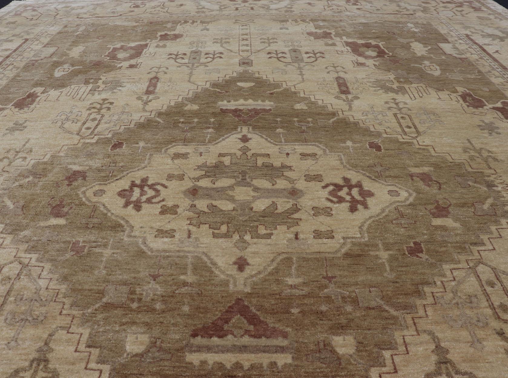 Indian Floral Medallion Oushak Area Rug Hand-Knotted in Tan, Taupe, and Brown. Country of Origin: India; Type: Oushak; Design: All-Over, Floral Medallion; Keivan Woven Arts: rug IN-JVD-6018; Indian Floral Medallion Oushak Area Rug. 
Measures: 10'2 x