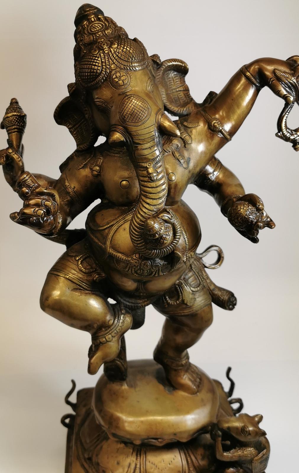 Indian brass highly detailed dancing four-arm Lord Ganesha deity statue, 
weighs 19kg.
Our eclectic stock crosses cultures, continents, styles and famous names.
