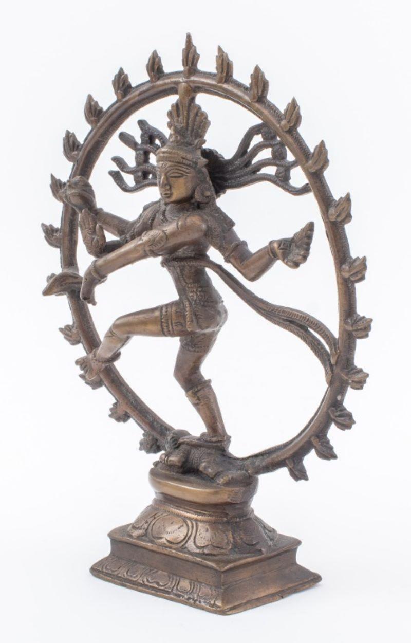Antique Indian gilt bronze statue sculpture of Shiva in the form of Nataraja, the Lord of Dance, performing the cosmic dance of creation encircled by a ring of flames / prabhamandala, he squashes Apasmara, the dwarf demon of ignorance beneath his