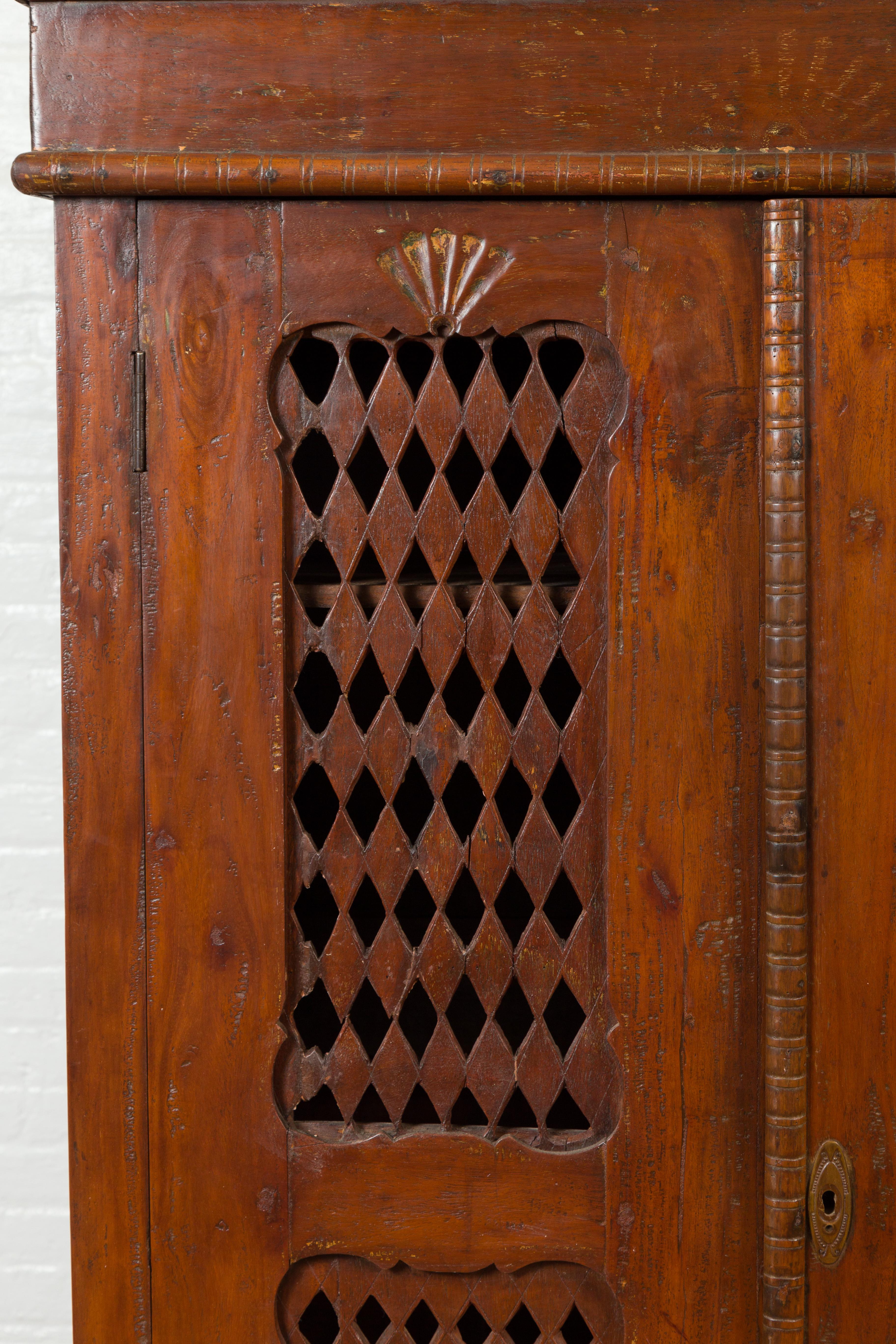 Hand-Carved Indian Hand Carved Cabinet with Open Diamond Design and Painted Fan Motifs For Sale