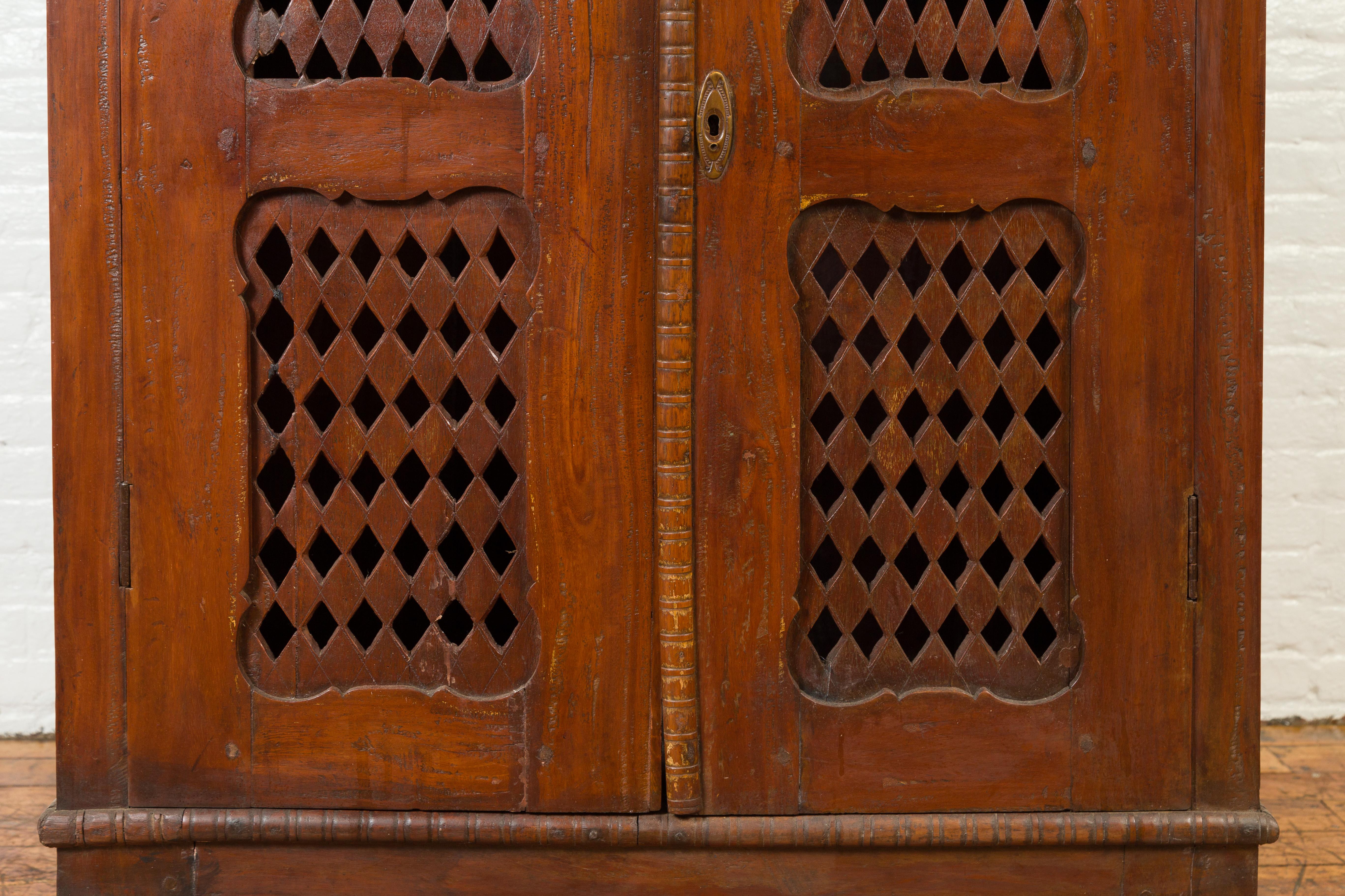 19th Century Indian Hand Carved Cabinet with Open Diamond Design and Painted Fan Motifs For Sale