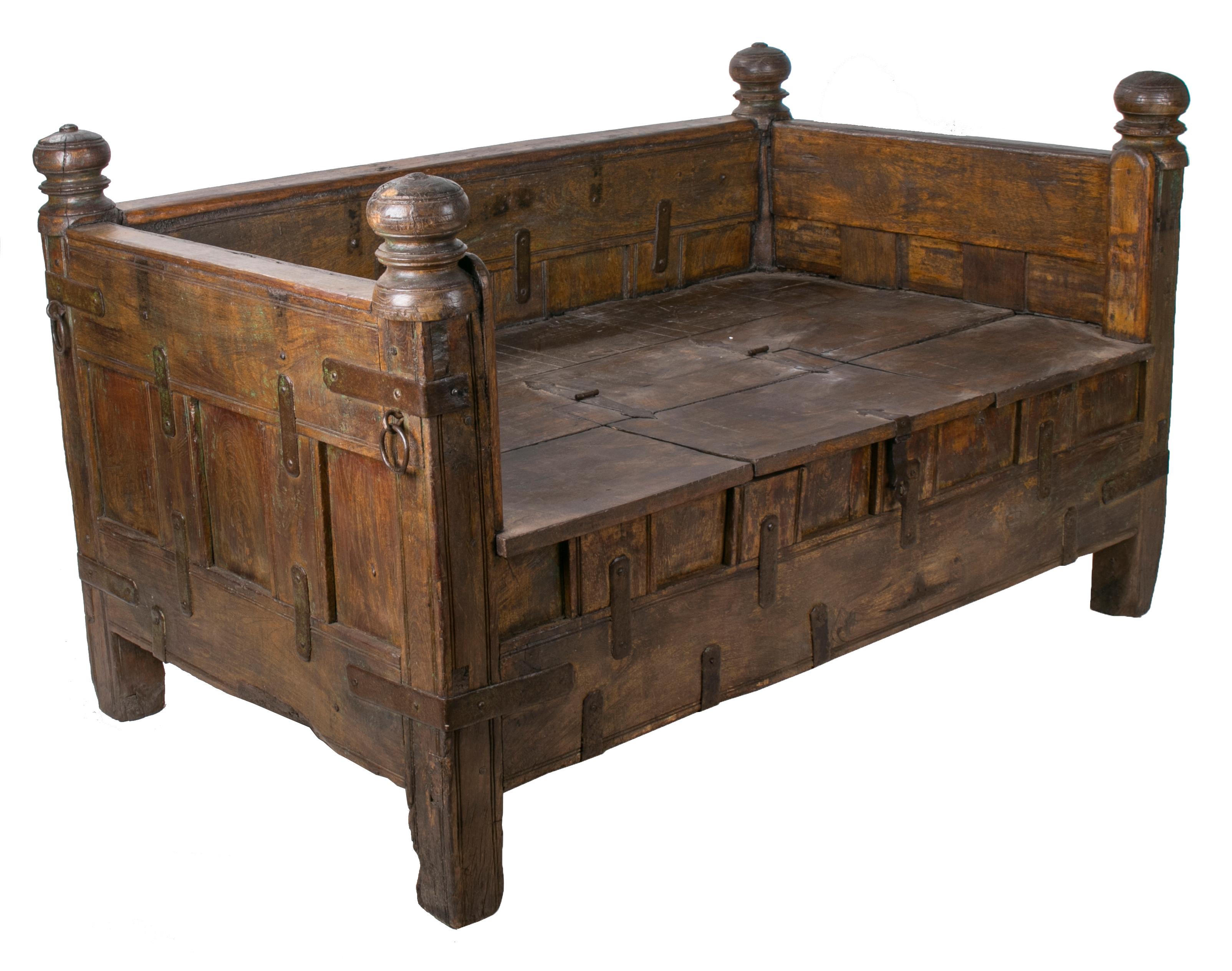 Indian hand carved iron bound teak bench with hinged seat.