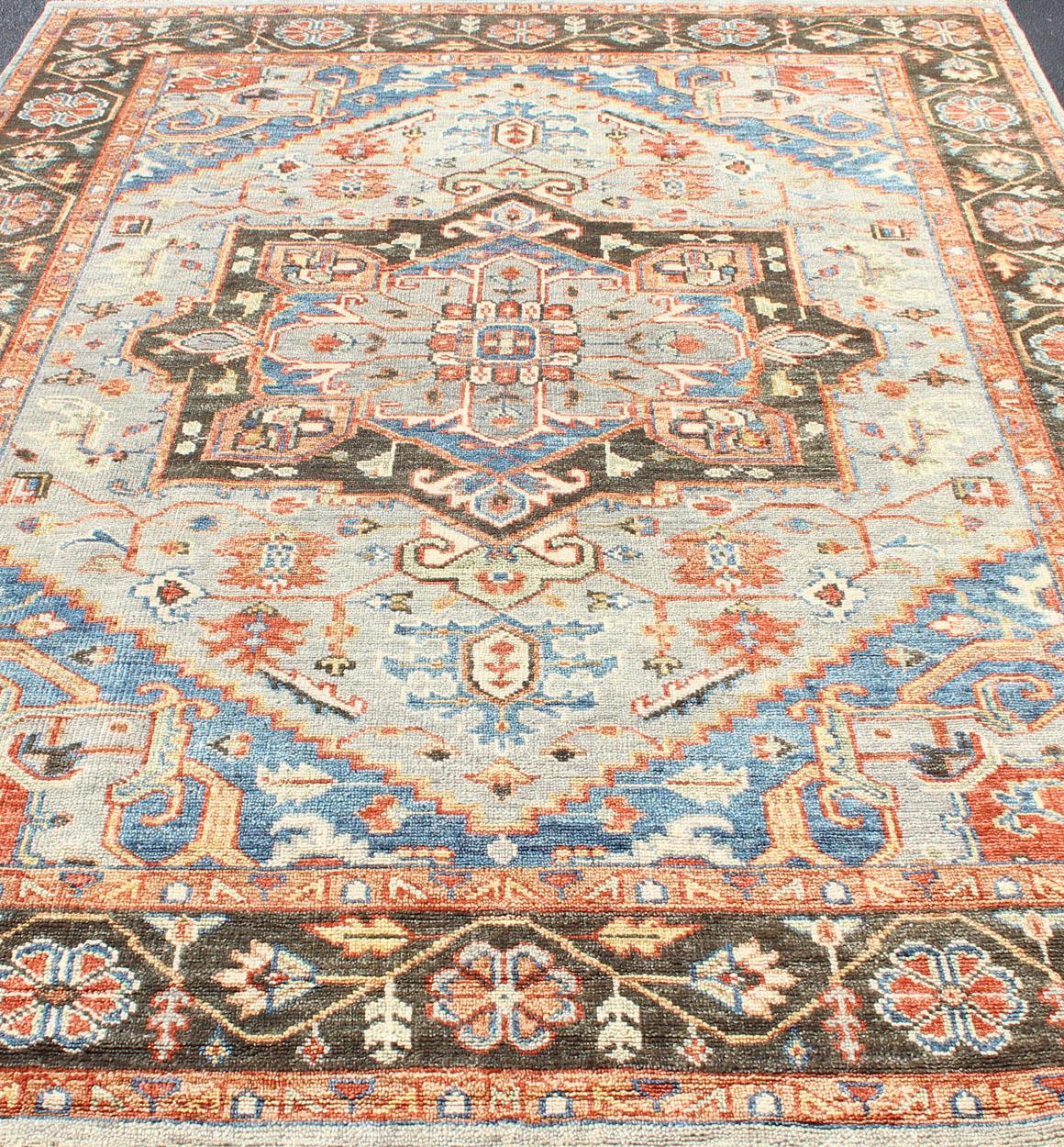 Hand-Knotted Heriz by Keivan Woven Arts in Brown, Ice Blue, Royal Blue & Red

Measures 8'6 x 11'10

This modern day Heriz rug was hand-knotted in India by Keivan Woven Arts, during the 2010's. The brown/cocoa colored border displays a repeating