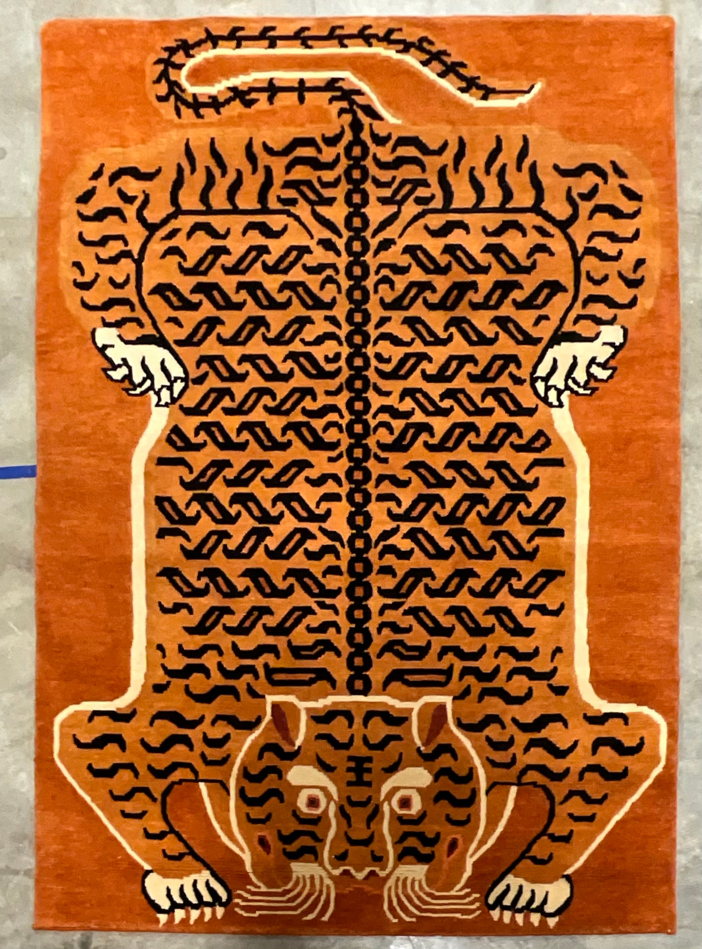 This is a fun area rug! It is an Indian hand knotted wool rug with a Chinese tiger motif. It is in very good condition.