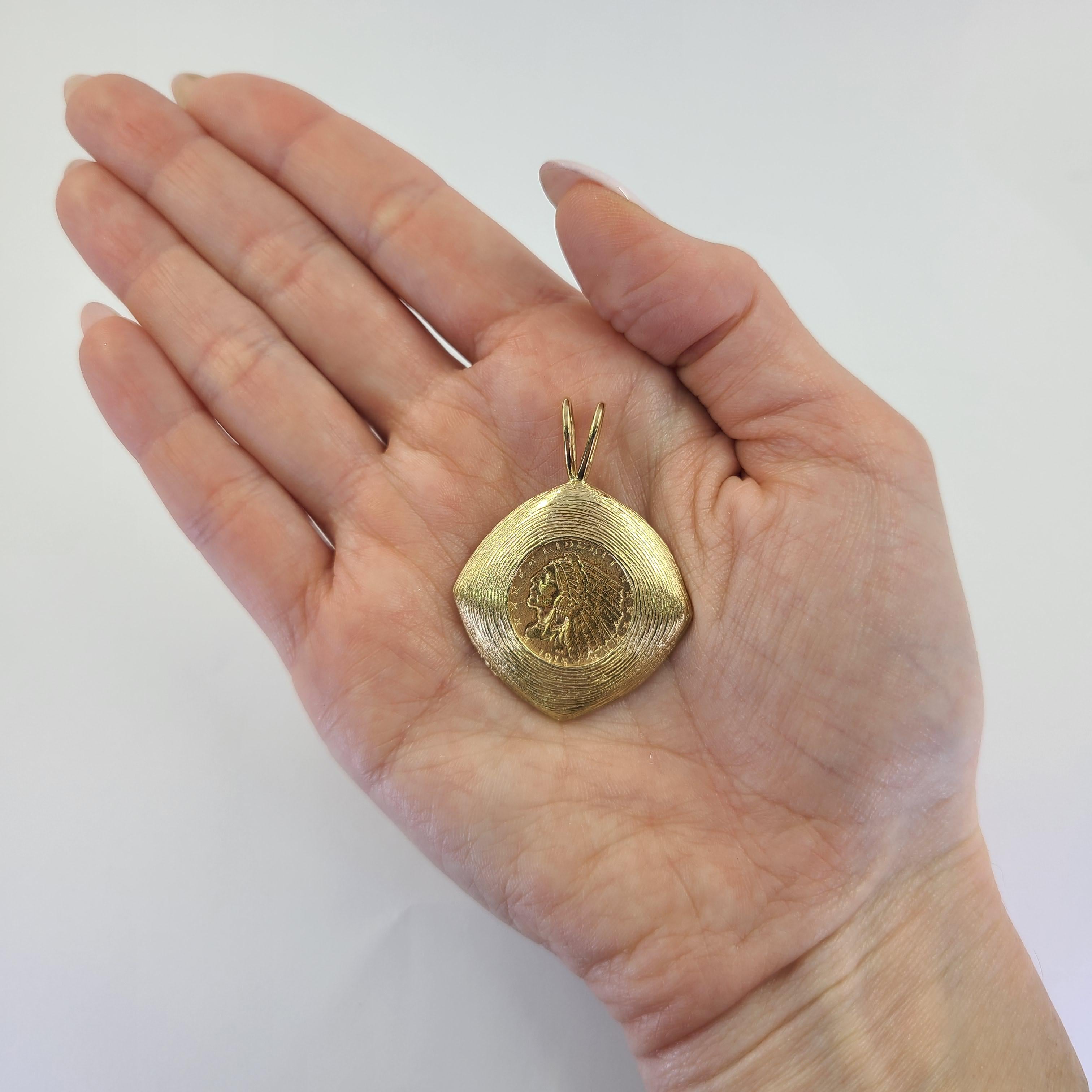 14 Karat Yellow Gold Textured Pendant Featuring A 22 Karat Yellow Gold $2.50 Indian Head Coin From 1915. 1.75 Inches Long Including Bale. Finished Weight Is 13.0 Grams.