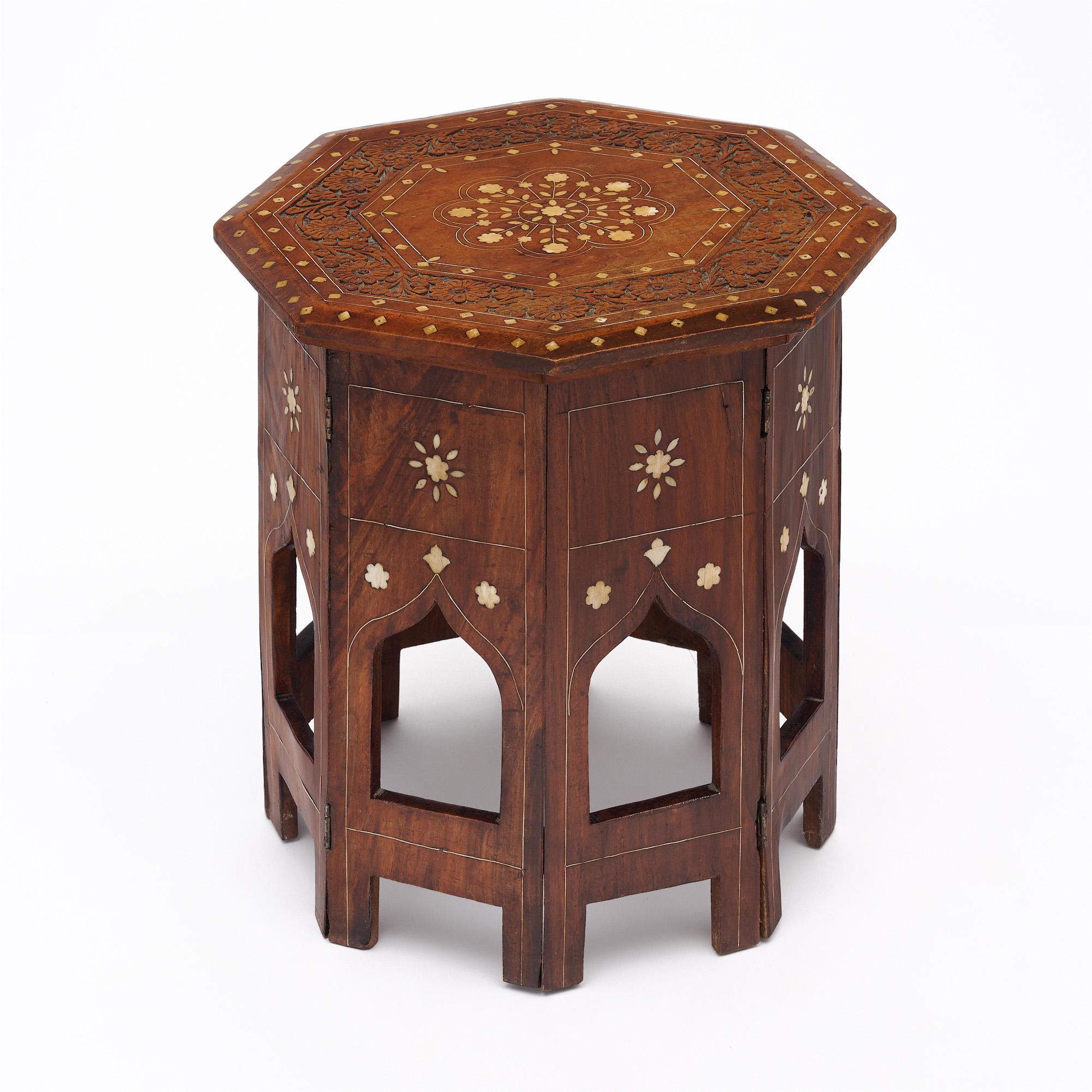 Side table with eight sides made with a wood construction from Hoshiarpur, India. This beautiful piece has wonderfully detailed engravings and bone inlay throughout. It is in excellent vintage condition – the photos accurately depict the condition.
