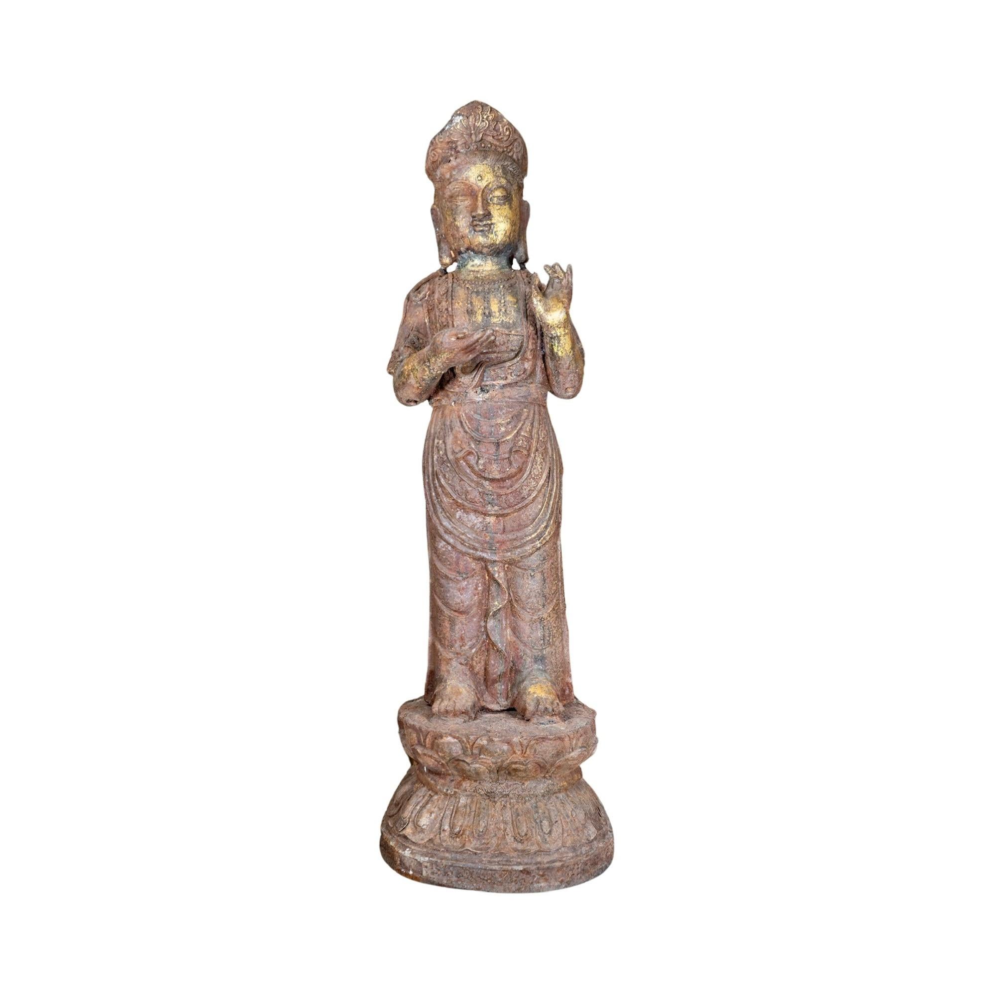 This Ming Dynasty iron-standing Guanyin sculpture from China in the 16th century is a masterpiece of cast iron with a rustic patina wear and a faded washed gold leaf finish. Perfect for collectors and admirers of ancient Chinese art, this standing