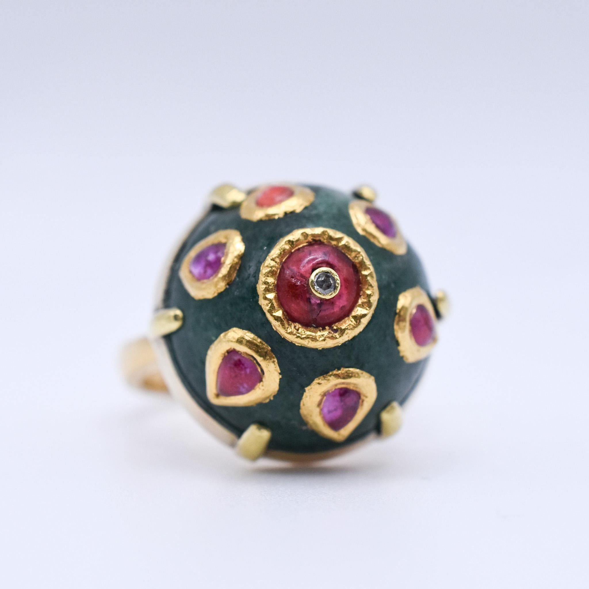 A beautiful Indian Bombe Jade Ring with Ruby accents all over the Dome, mounted in 18k Yellow Gold. Circa 1960.