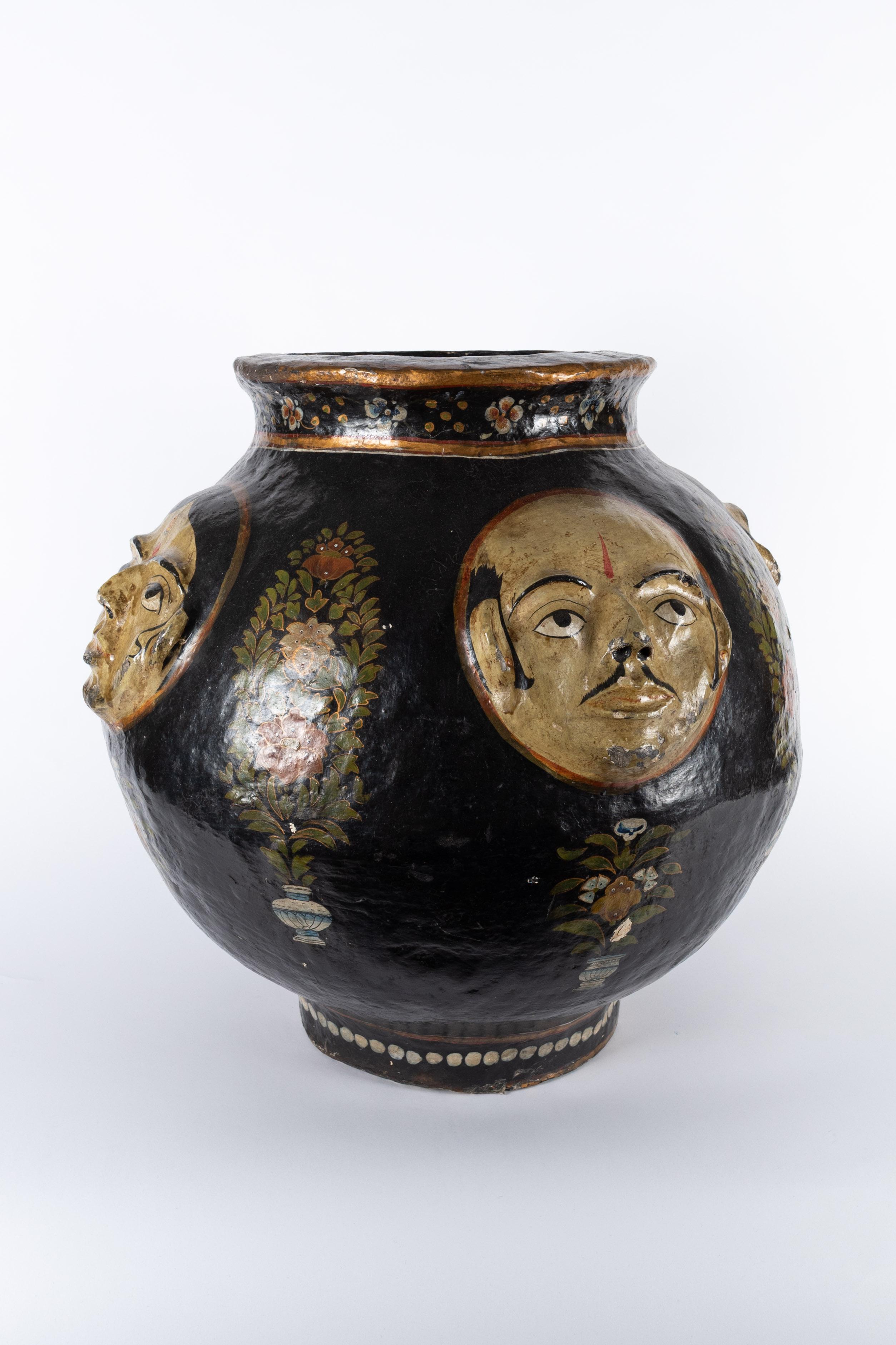 Indian (Kashmir) 19th century papier maché vase with relief decor of faces. 