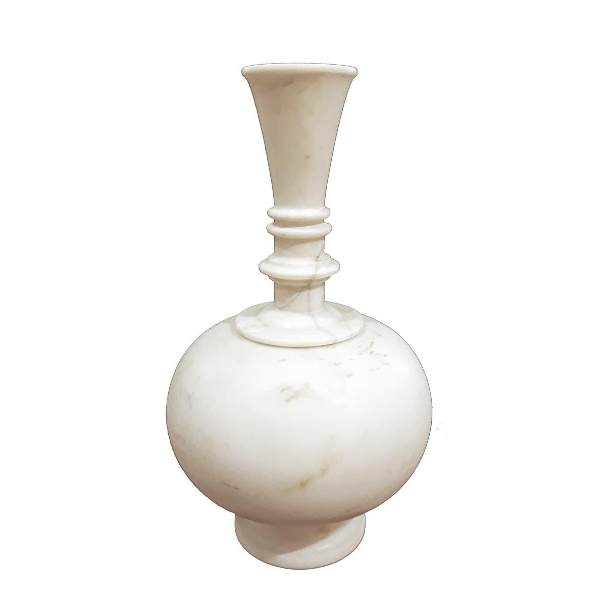A sleek, elegant marble vase with fluted neck. Statuary marble, hand-crafted in India, late 20th century. 
It has two separate pieces, which gives the vessel the versatility to become a short round vase, or a long one. 
Measures: 12 inches high, 7