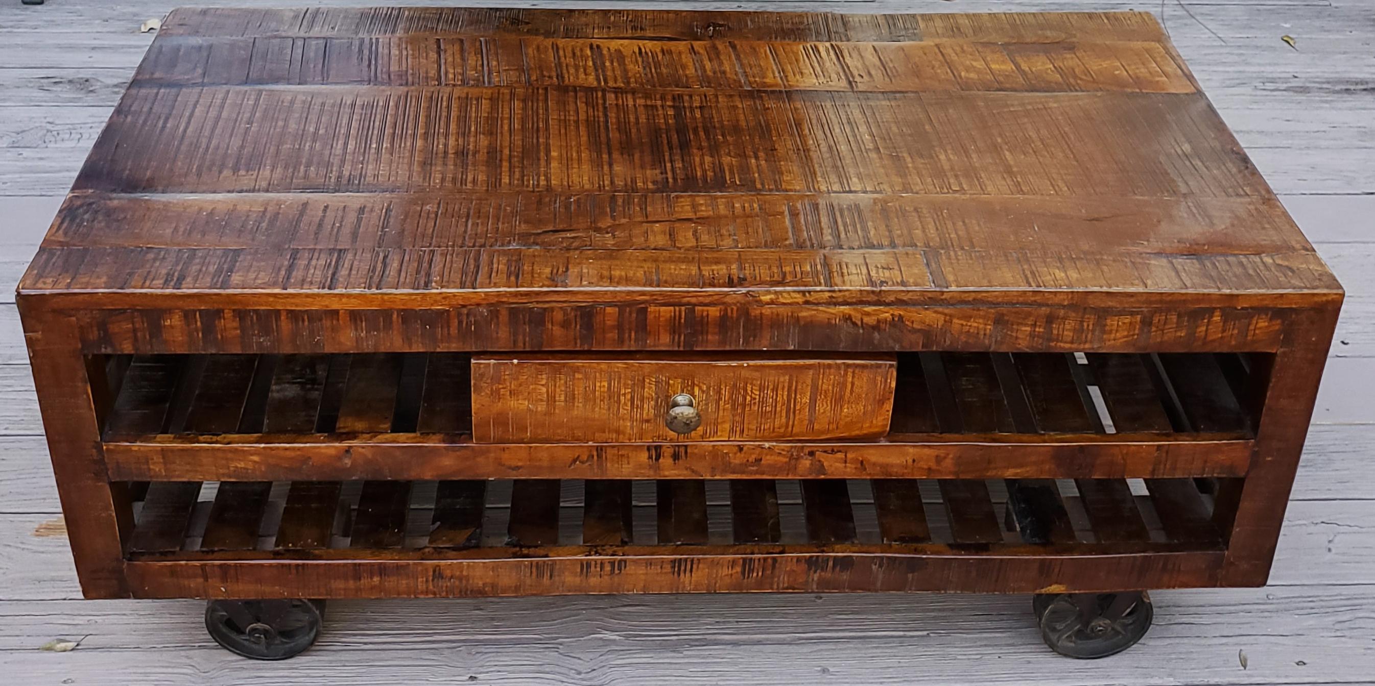 A pretty exotic looking Indian wooden coffee table. Rectangular shape with plenty of storage. Low height. Immaculate shape. This table will no doubt be an excellent add-on to your home or office décor. It measures approximately 48