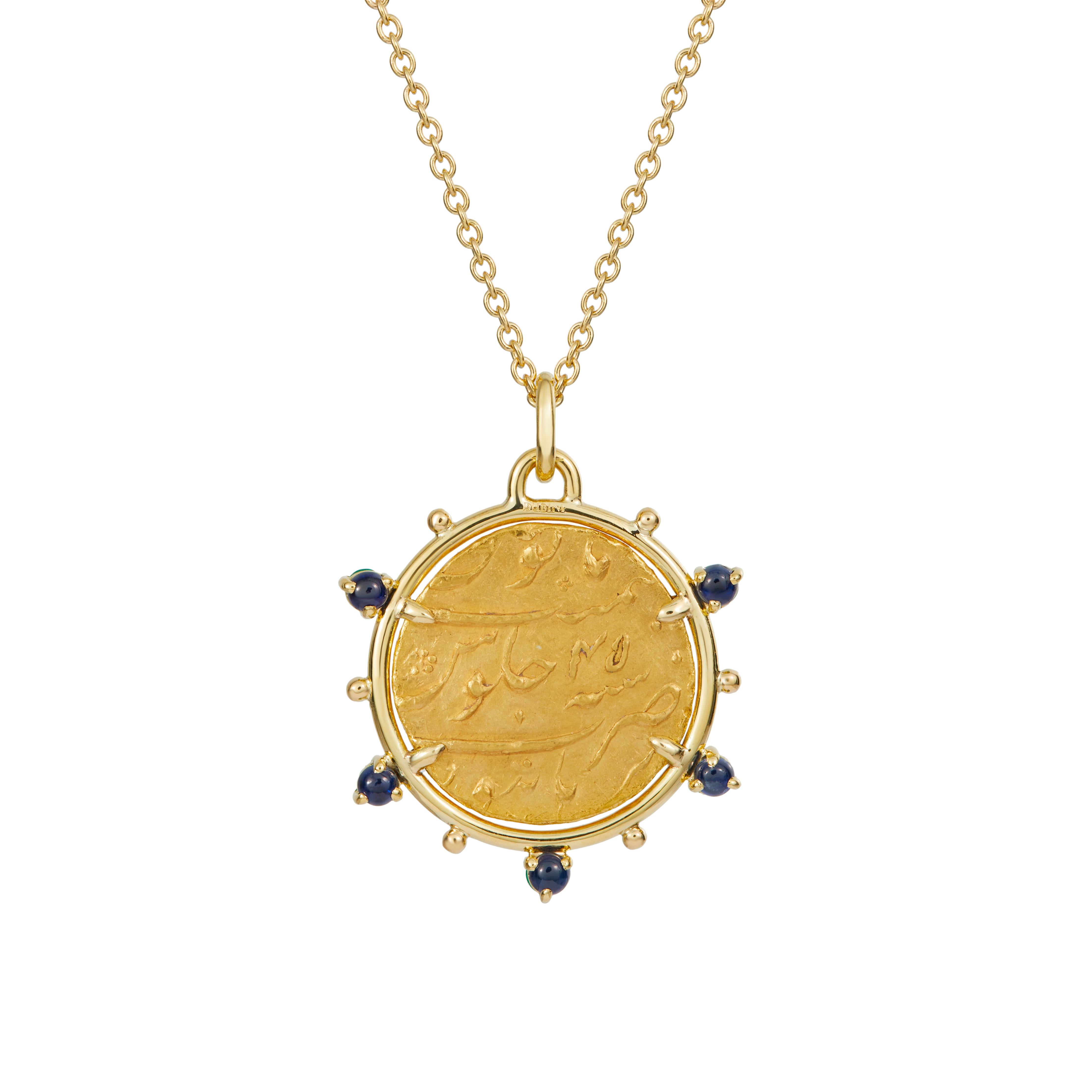 This DUBINI coin necklace from the 'Empires' collection features an ancient Mughal Empire yellow gold coin set in 18K yellow gold with emerald and sapphire cabochons.

Handmade in Rome.

Coin Ø 23mm
Chain length - 47cm 

DEPICTED ON THE COIN
India,