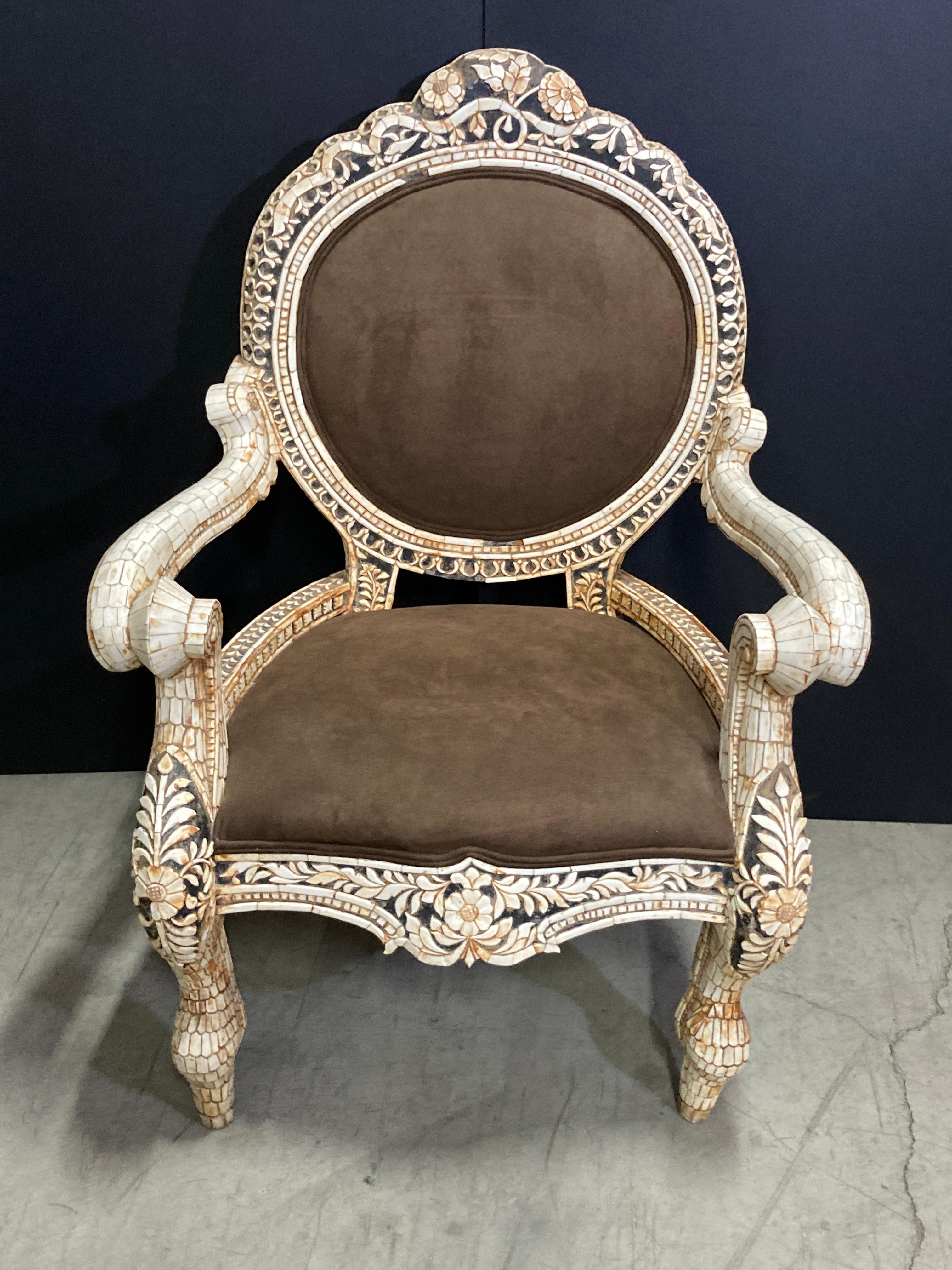 Amazing Indian bone inlaid armchair featuring a shaped back and cabriole leg.
Fabulous one of a kind throne armchair heavily inlaid with carved recycled buffalo Horn.
Will look fabulous in a Moorish Moroccan Mughal Interior decor.
Anglo Indian