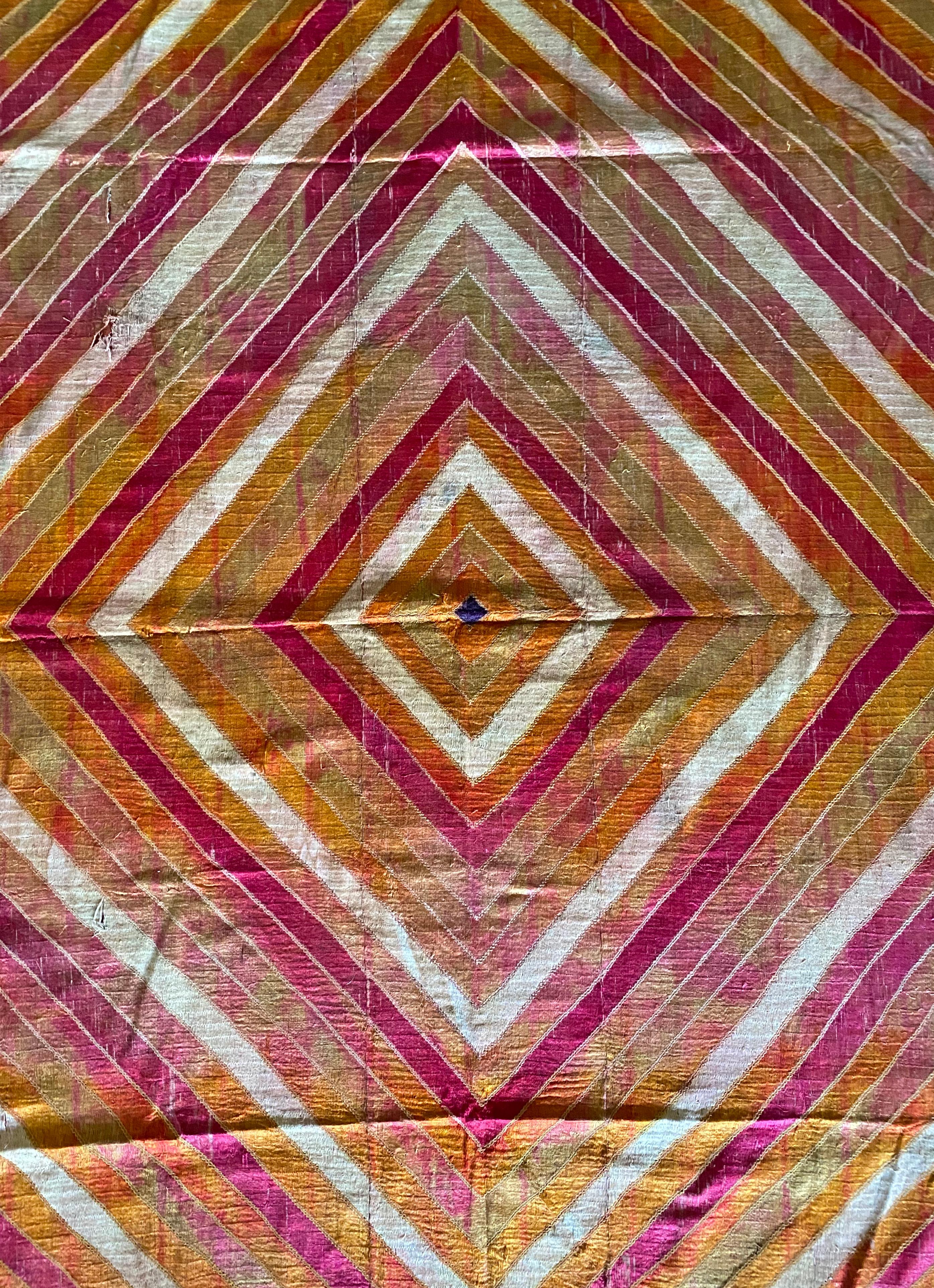 This strikingly coloured Phulkari is from Punjab, India. It was hand-crafted from silk and cotton, with silk being used for the embroidery. Phulkari’s are a form of wedding shawl and are used by bride’s amidst marriage ceremonies. What makes