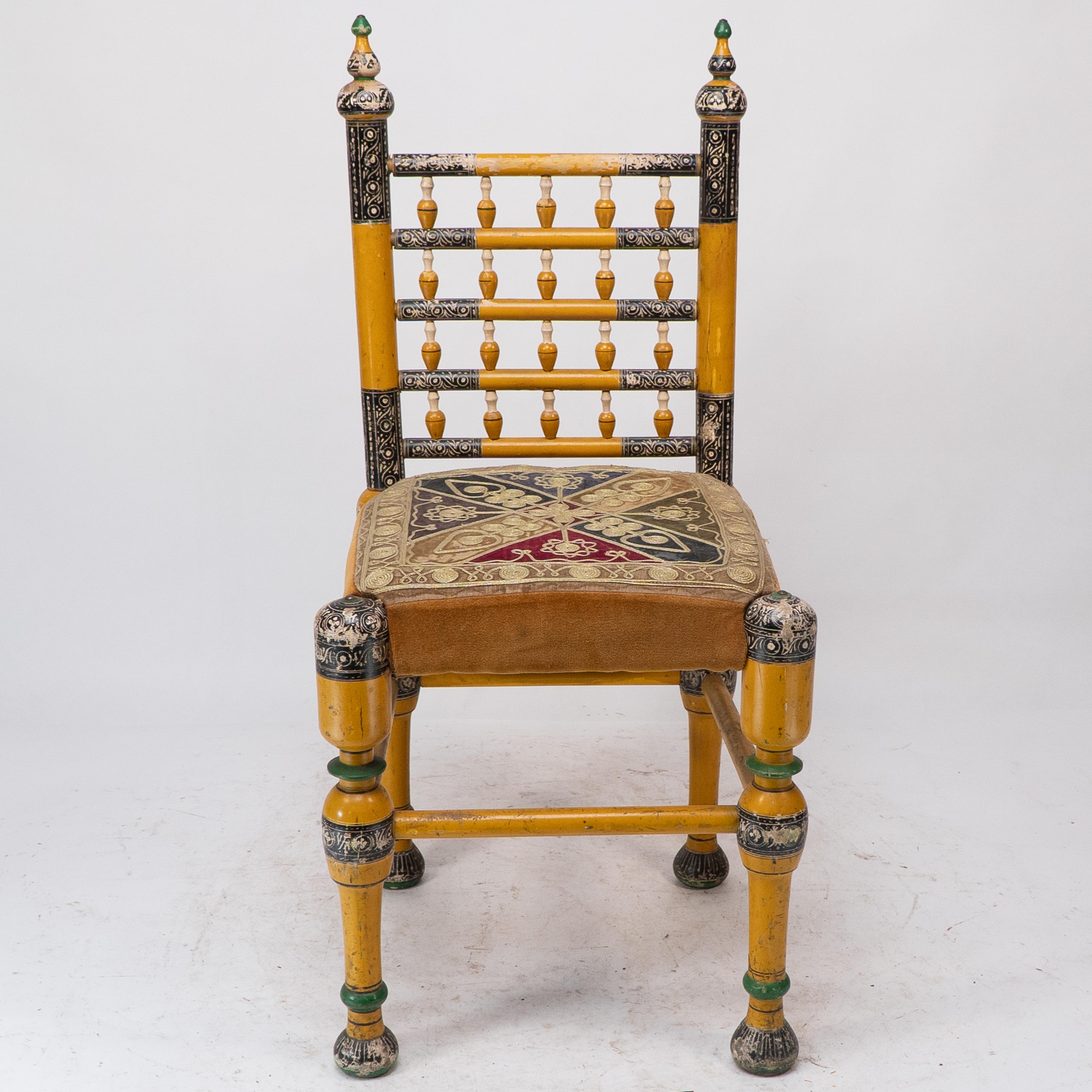 Painted Indian Rajasthani A pair of polychrome painted chairs with gilt chord embroidery For Sale
