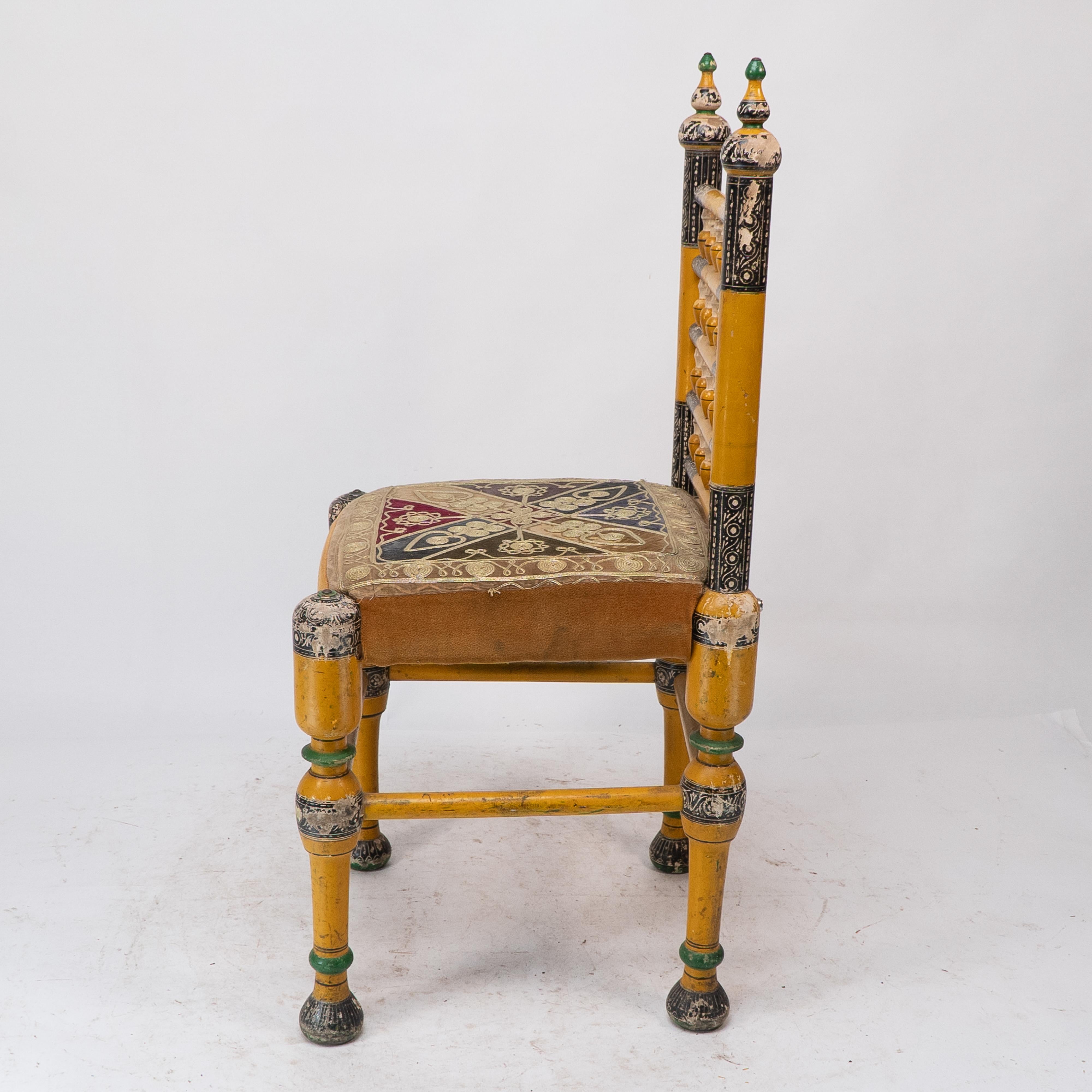 Early 20th Century Indian Rajasthani A pair of polychrome painted chairs with gilt chord embroidery For Sale
